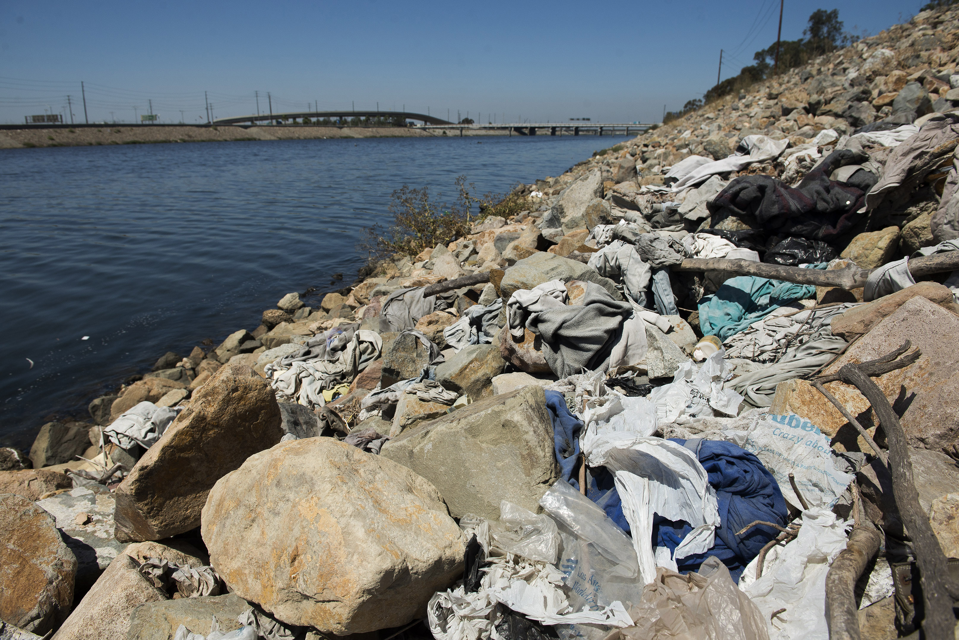 FILE-This Tuesday, Sept. 2, 2014 file photo shows a large pile of washed-up trash, including old plastic bags, sits alongside the Los Angeles River in Long Beach, Calif. On Tuesday, Sept. 30, 2014 Gov. Jerry Brown signed legislation on  imposing the nation's first statewide ban on single-use plastic bags. (AP Photo/The Orange County Register, Josh Morgan,File)   MAGS OUT; LOS ANGELES TIMES OUT (AP Photo/The Orange County Register, Josh Morgan,File)