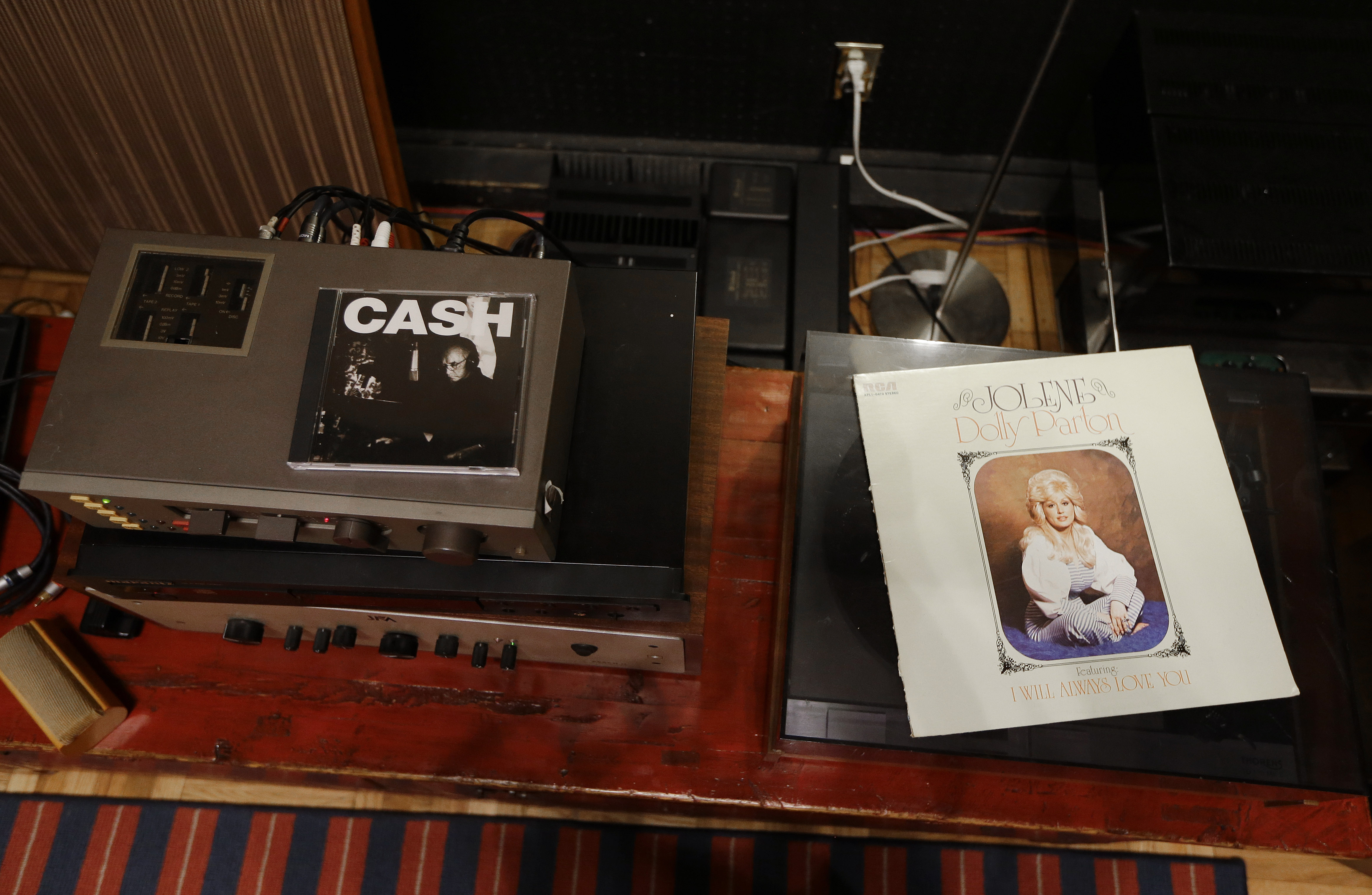 Albums by Johnny Cash and Dolly Parton sit on stereo equipment in RCA Studio A on Aug. 8, 2014 in Nashville, Tenn. (AP Photo/Mark Humphrey) (AP)