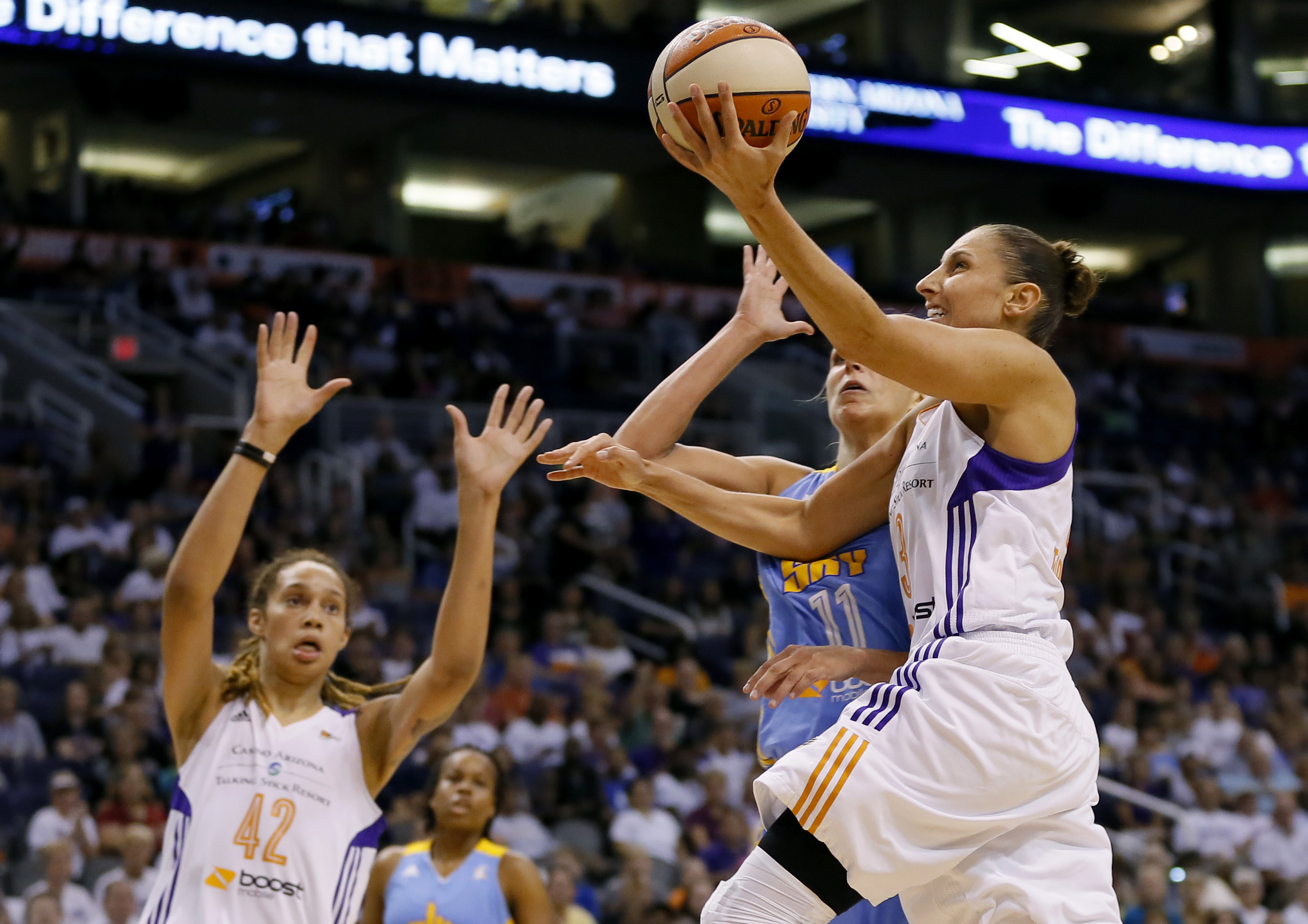 Phoenix Mercury guard Diana Taursai shoots over Chicago Sky forward Elena Delle Donne (11) during the first half of  Game 2 of the WNBA basketball finals, Tuesday, Sept. 9, 2014, in Phoenix. (AP Photo/Matt York) (AP)