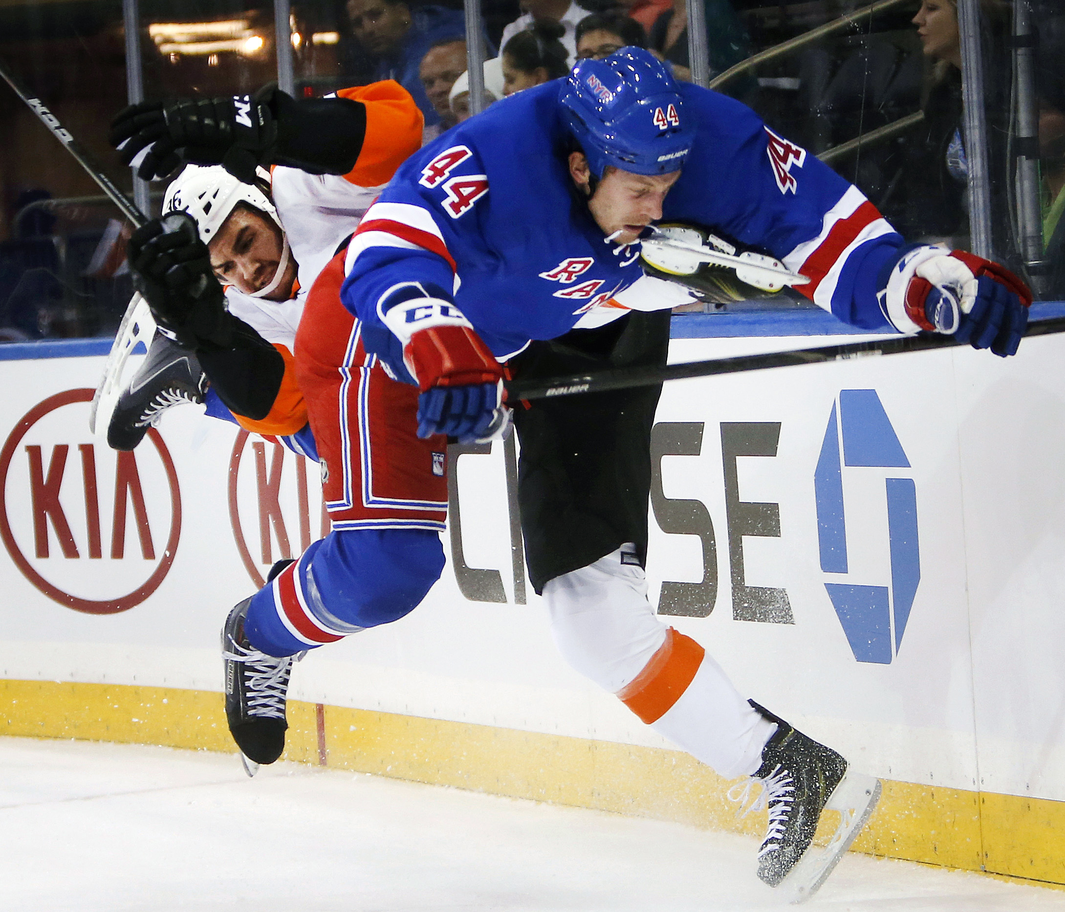 10ThingstoSeeSports - Philadelphia Flyers' Zac Rinaldo, left, and New York Rangers' Matt Hunwick (44) collide during the first period of an NHL preseason hockey game Monday, Sept. 29, 2014, in New York. (AP Photo/Jason DeCrow, File) (AP)