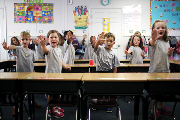 Columbus Charter School in Whiteville, N.C., uses a rigid instructional approach in which teachers stick to a script and drill students, like the kindergarteners above, through call and response. (Travis Dove for ProPublica)