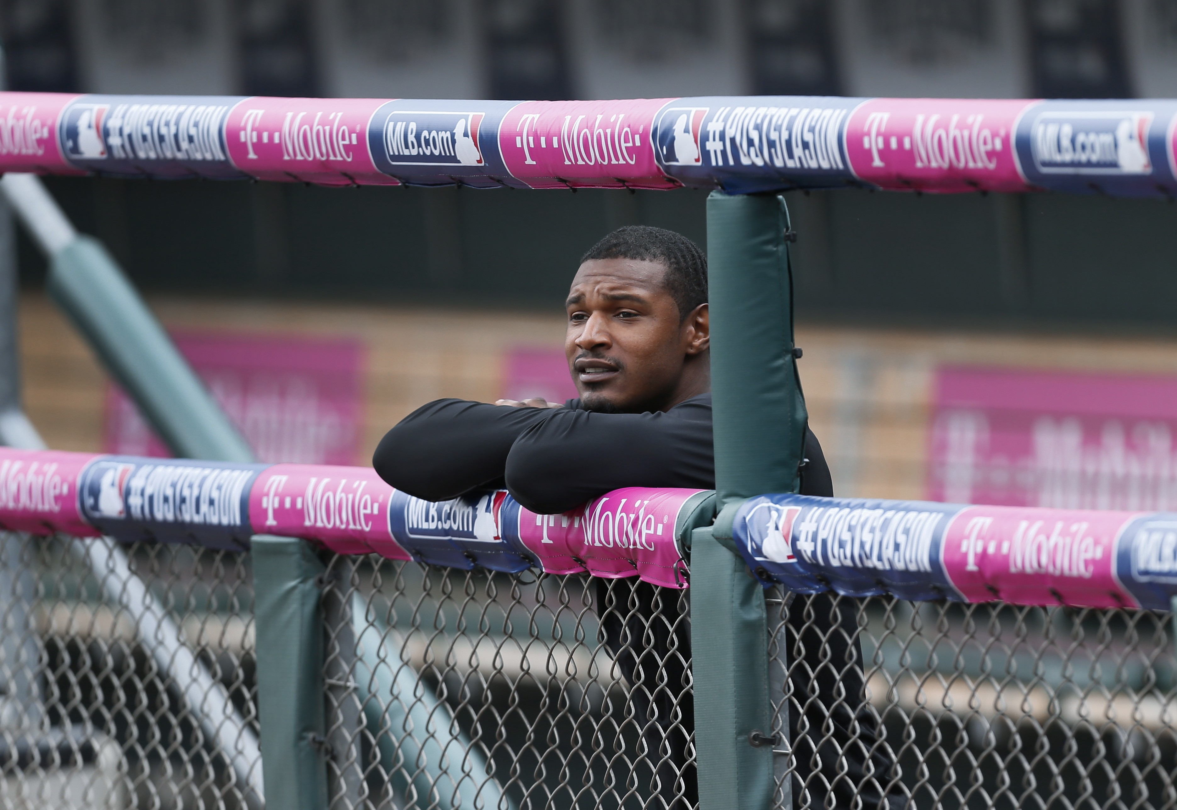 Baltimore Orioles' Adam Jones watches from the dugout railing during baseball practice, Saturday, Oct. 4, 2014, in Detroit, in preparation for Sunday's Game 3 of the American League Division Series against the Detroit Tigers. Baltimore leads the best-of-five games series 2-0. (AP Photo/Paul Sancya) (AP)