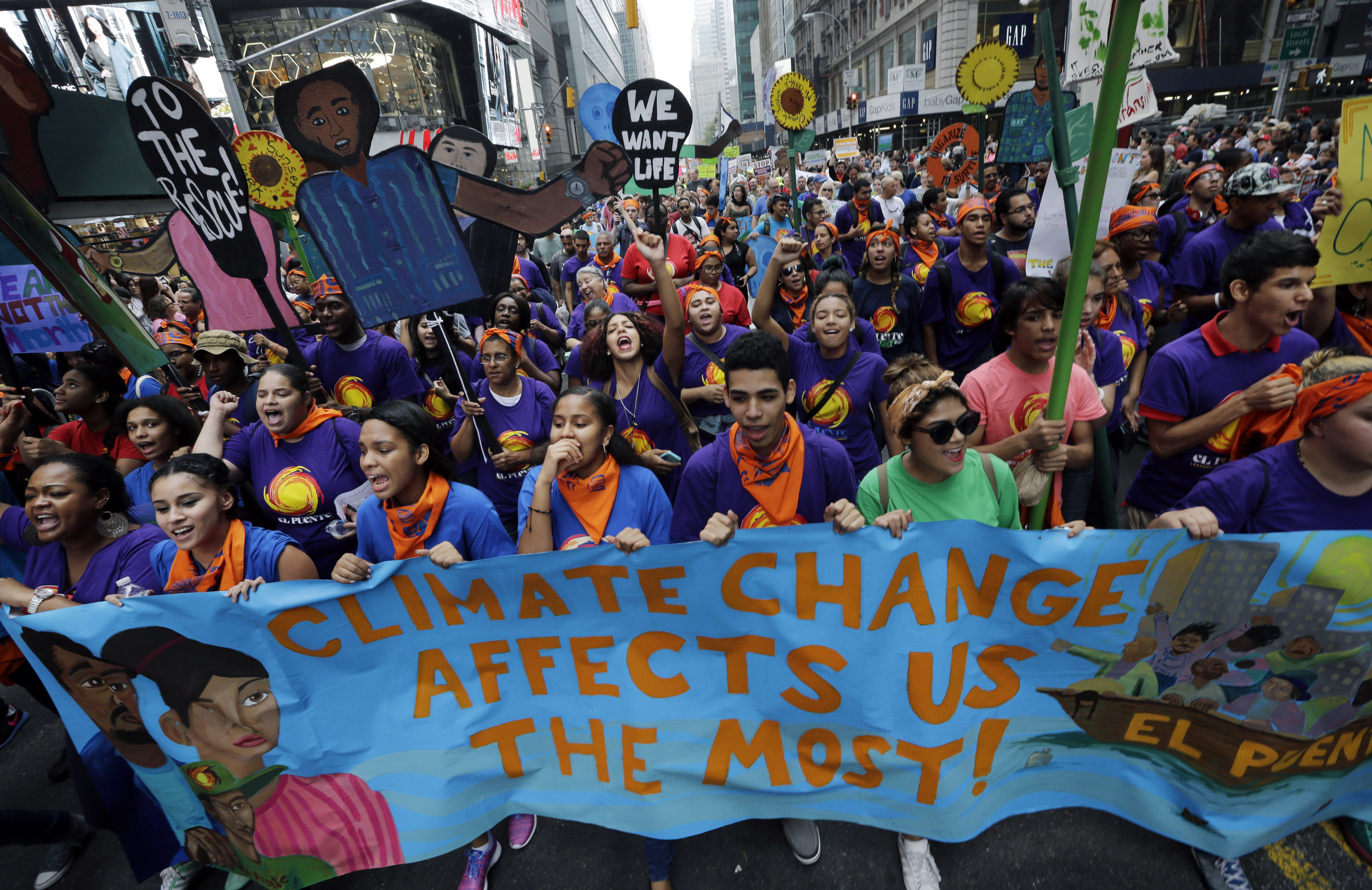 FILE - In the Sept. 21, 2014 file photo thousands of young people fill the streets of Manhattan, New York, carrying banners and calling on policymakers to take action on climate change. According to a new Associated Press-GfK poll, conducted September 25-29, 2014, Americans lack confidence that their government can keep them safe from threats to their safety and economic security. More than half of those polled dont think the U.S. government can do much to effectively minimize the threat posed by climate change, mass shootings, racial tensions, economic uncertainty on Wall Street and an unstable job market. (AP Photo/Mel Evans, File) (AP)