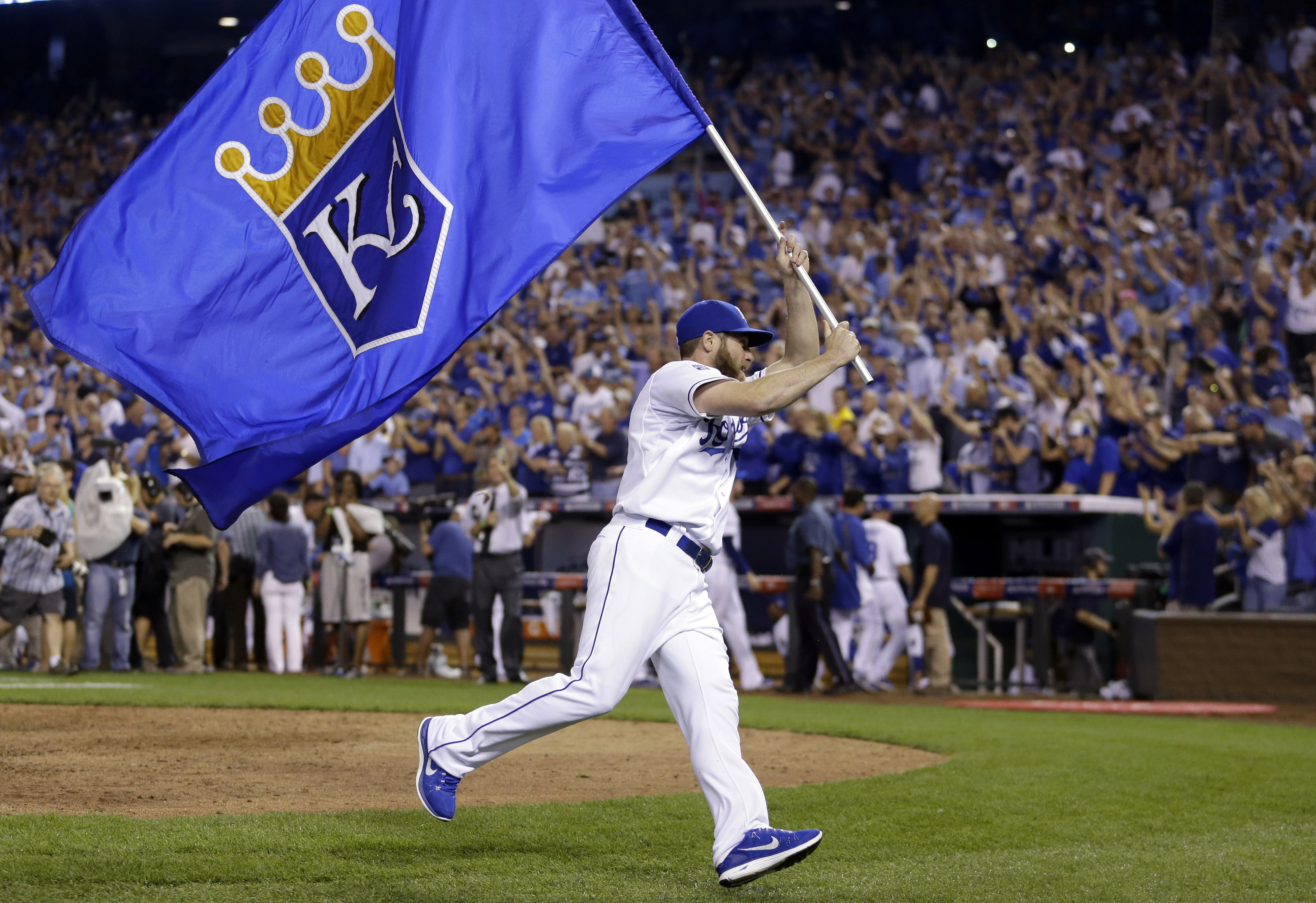 Kansas City Royals' Greg Holland celebrates after the Royals' 9-8 victory over the Oakland Athletics in 12 innings in the AL wild-card playoff baseball game Tuesday, Sept. 30, 2014, in Kansas City, Mo. (AP Photo/Jeff Roberson) (AP)