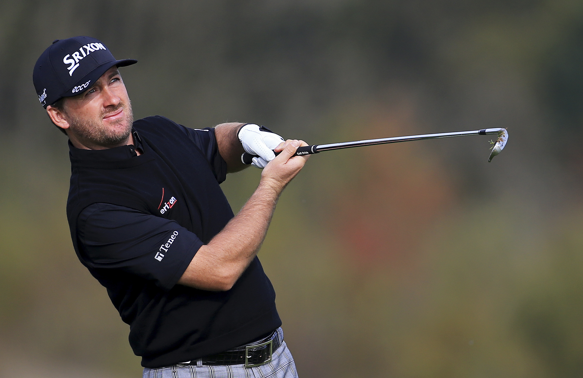 Northern Ireland's Graeme McDowell plays a shot during day two of the World Match Play Championship at The London Golf Club, golf course in Ash southeast England  Thursday Oct.  16, 2014. (AP Photo/Gareth Fuller/PA) UNITED KINGDOM OUT NO SALES NO ARCHIVE (AP)