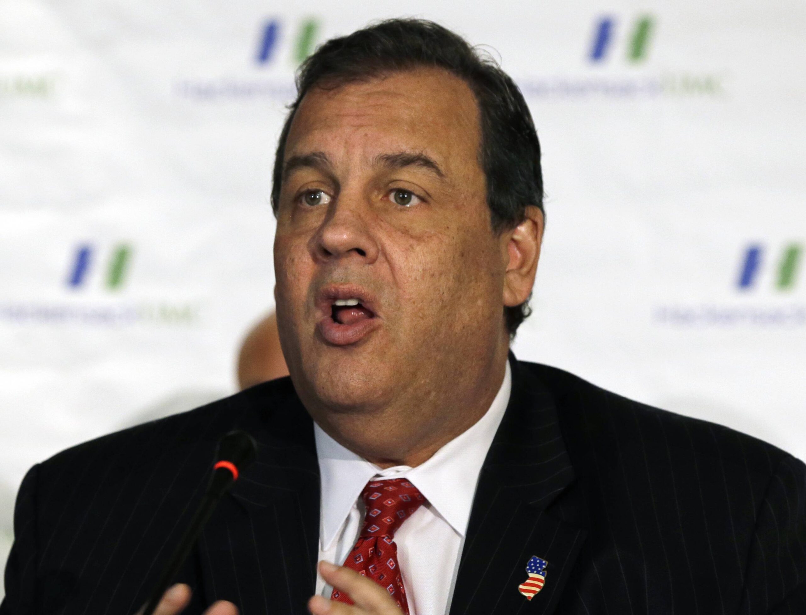 In this Wednesday, Oct. 22, 2014 photograph, New Jersey Gov. Chris Christie addresses a gathering over the state's preparedness for Ebola treatment at Hackensack University Medical Center in Hackensack, N.J. Christie on Sunday, Oct. 26, 2014 defended the mandatory, 21-day quarantining of medical workers returning from West Africa as necessary to protect the public and predicted it "will become a national policy sooner rather than later." (AP Photo/Mel Evans) (AP)