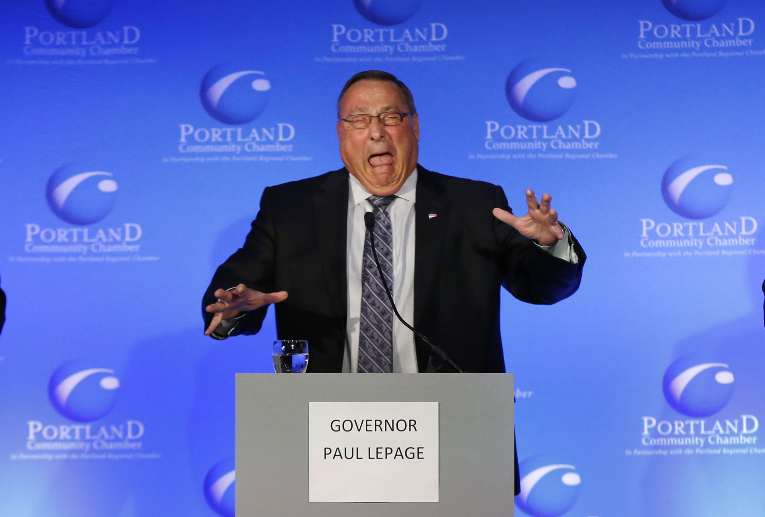 FILE - This Oct. 8, 2014, file photo shows Republican Governor of Maine, Paul LePage, center, making a face after taking the stage to debate other gubernatorial candidates in Portland, Maine. To some in Maine LePage is hot-headed and divisive. Others consider his unconventional approach to governing a breath of fresh air. In a tight three-way race for governor marked by fights over welfare, health care and jobs, the core question often focuses on LePage's abrasive leadership style.  (AP Photo/Robert F. Bukaty, File) (AP)