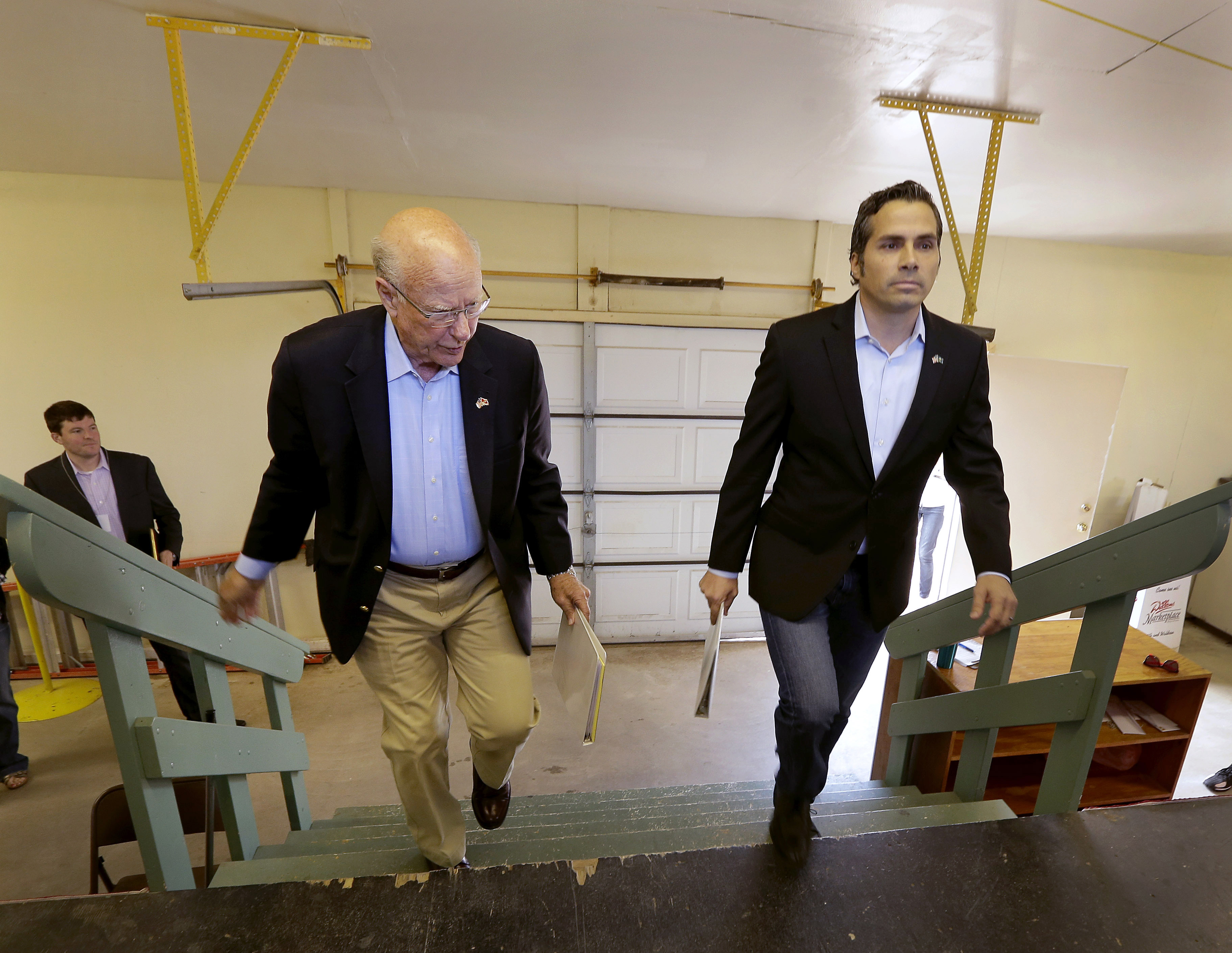 FILE - In this Sept. 6, 2014 file photo Republican Sen. Pat Roberts, left, and Greg Orman walk to the stage before a Senate debate in Hutchinson, Kan. Orman, an independent candidate challenging Roberts for the U.S. Senate in Kansas, has turned a longshot independent bid into a threat to the GOP veteran. Even if Roberts survives the challenge from independent Orman, Republicans also must lock down South Dakota, a once-unthinkable concern. (AP Photo/Charlie Riedel, File) (AP)
