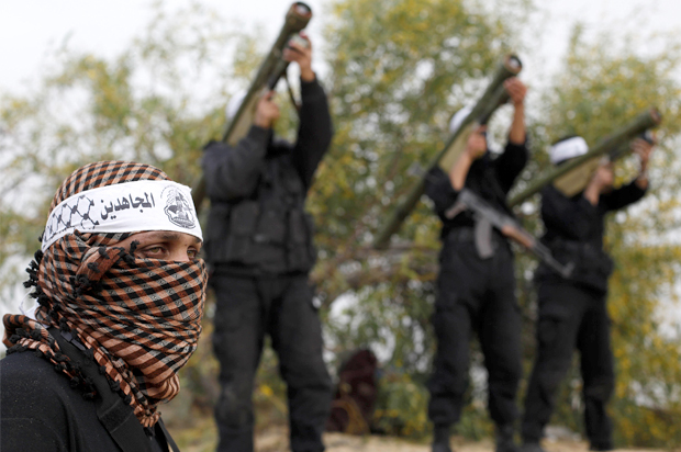 Palestinian militants of al-Mujahideen brigades in the southern Gaza Strip March 8, 2013. (Reuters/Ibraheem Abu Mustafa)