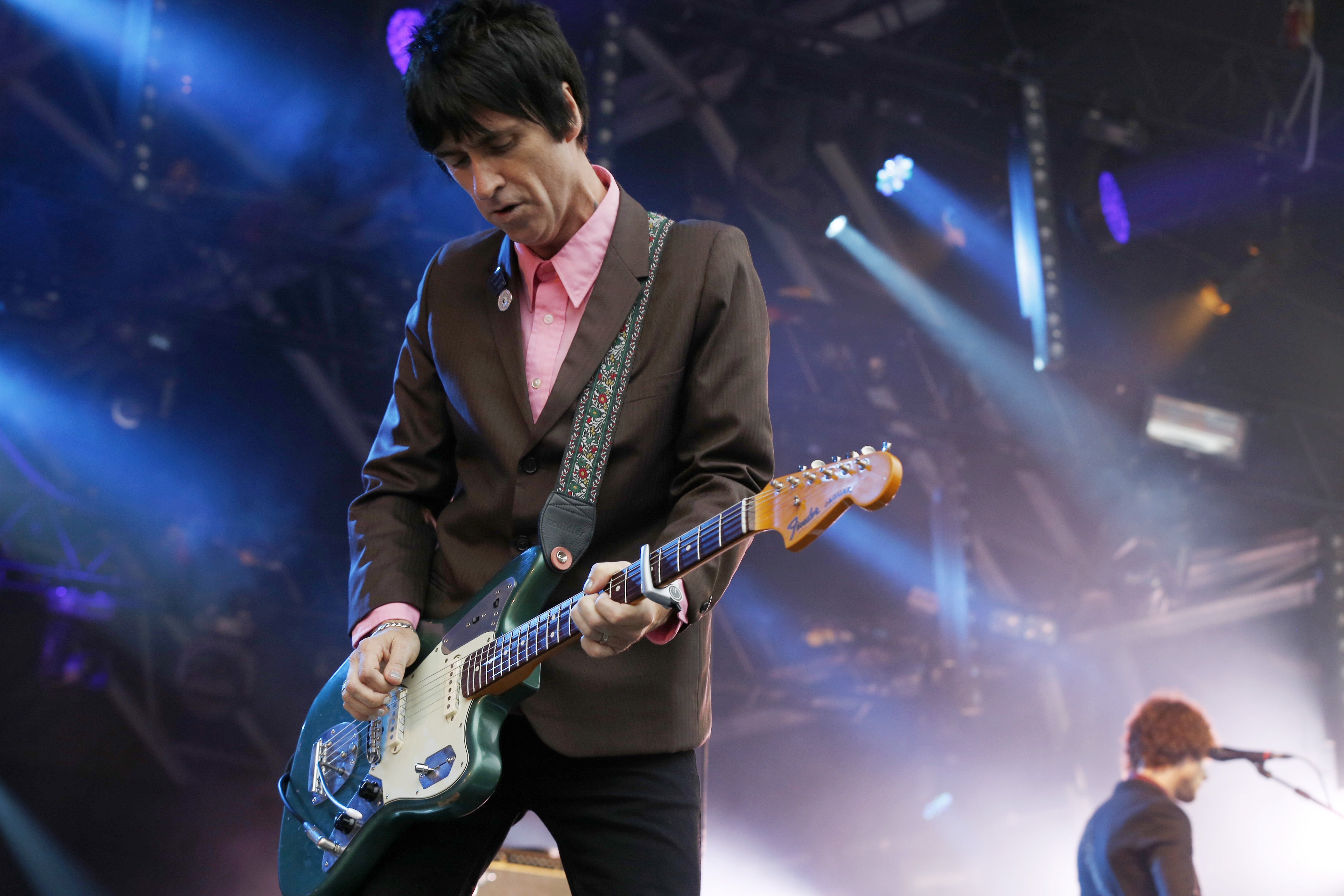 FILE - In this Aug. 1, 2014 file photo, British singer Johnny Marr performs at Camp Bestival at Lulworth Castle in Dorset, England.The former guitarist for The Smiths has just released his second solo album, "Playland," a follow-up to well-received 2013 effort "The Messenger." Both offer robust, richly textured guitar rock _ the latest of Marr's many musical modes.  (Photo by Jim Ross/Invision/AP, File) (Jim Ross/invision/ap)