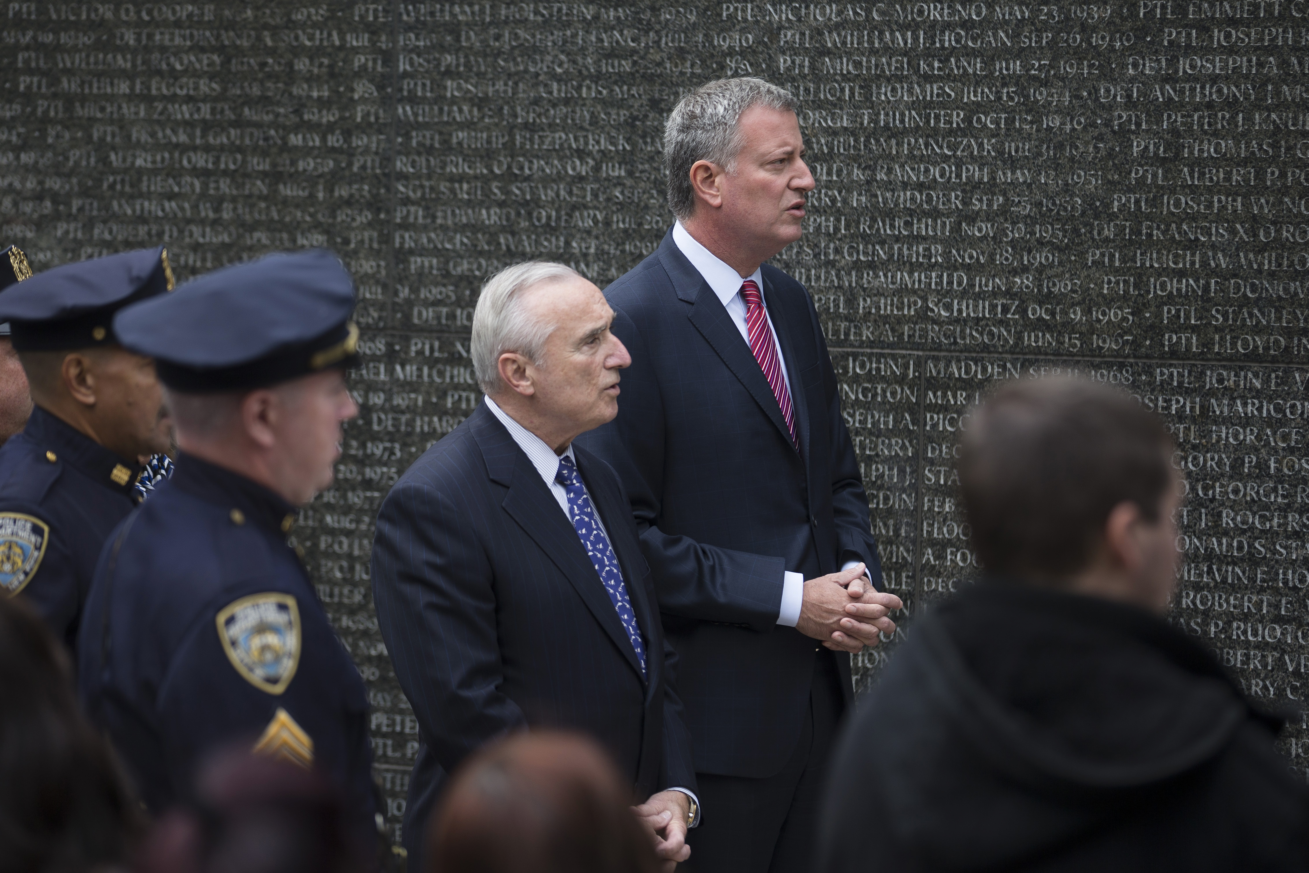 Mayor Bill de Blasio talks with New York City Police Commissioner Bill Bratton during a NYPD Memorial ceremony last October in New York. (AP Photo/John Minchillo)