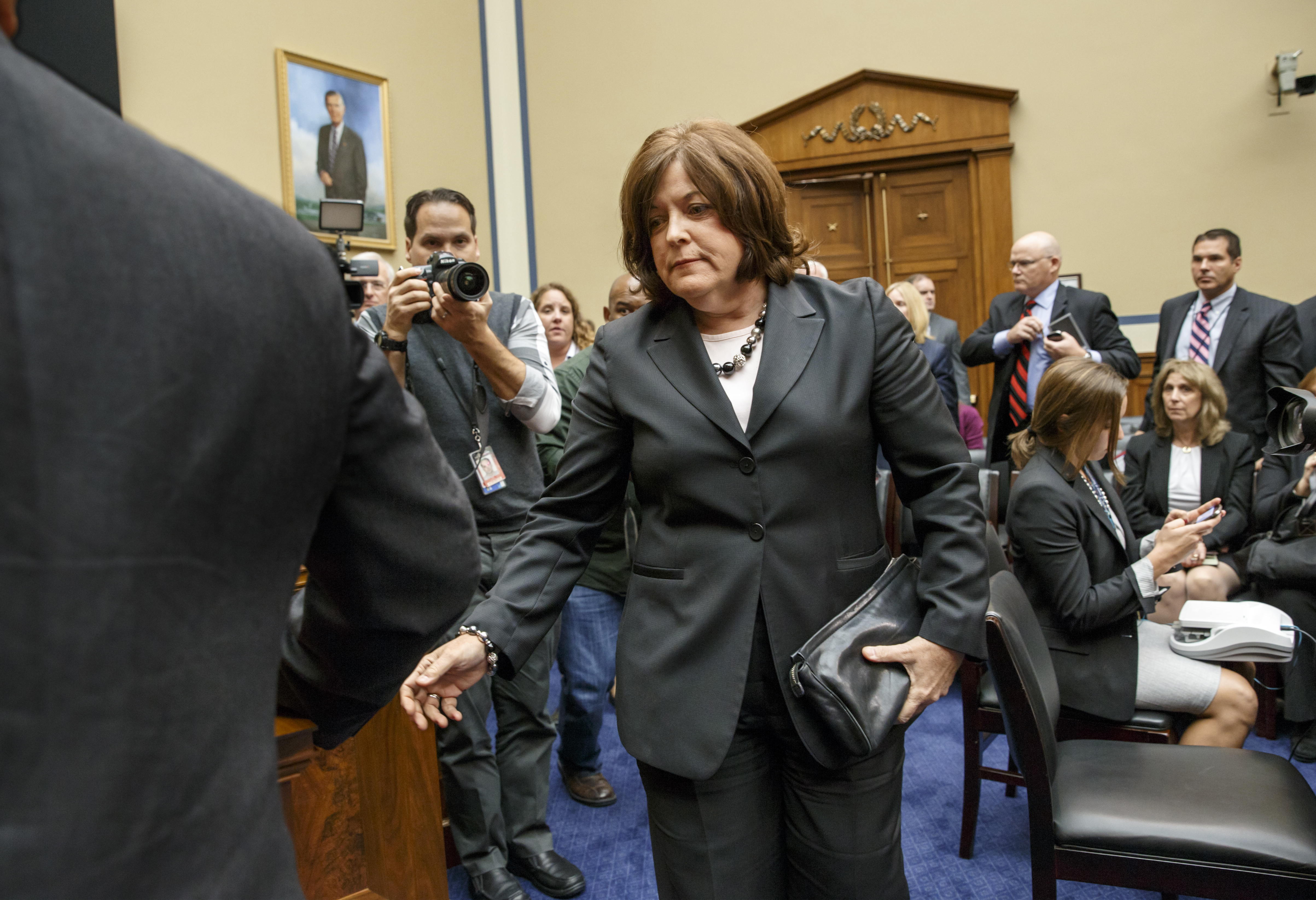 Secret Service Director Julia Pierson leaves the hearing room on Capitol Hill in Washington, Tuesday, Sept. 30, 2014, after she testified before the House Oversight Committee about details surrounding a security breach at the White House when a man climbed over a fence, sprinted across the north lawn and dash deep into the executive mansion before finally being subdued.  (AP Photo/J. Scott Applewhite) (AP)