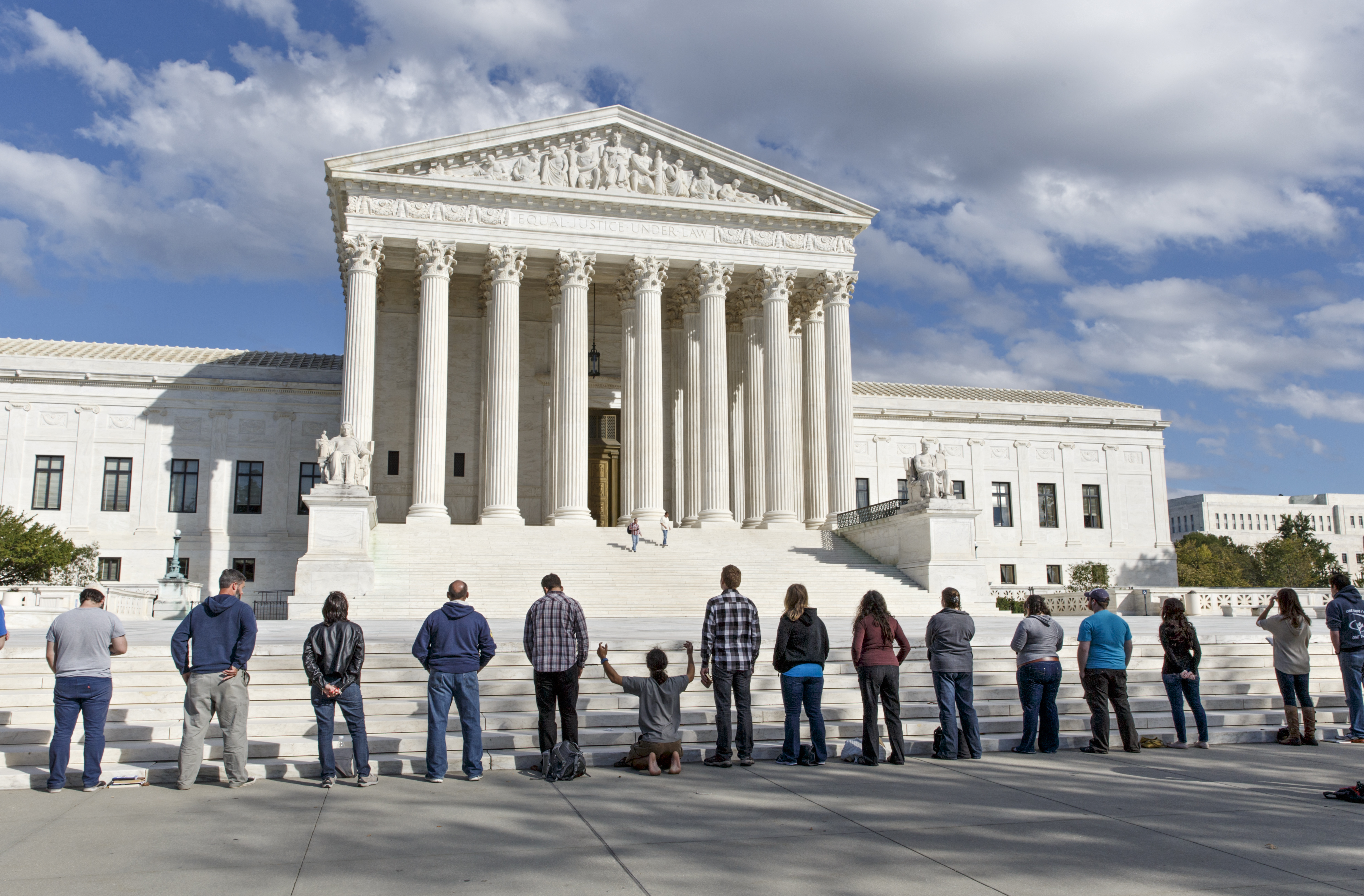 As the Supreme Court begins its new term this week, pro-life advocates hold a prayer vigil on the plaza of the high court in Washington, Saturday, Oct. 4, 2014. The group, Bound 4 Life, has come to the court for ten years to make a silent appeal against abortion. (AP)