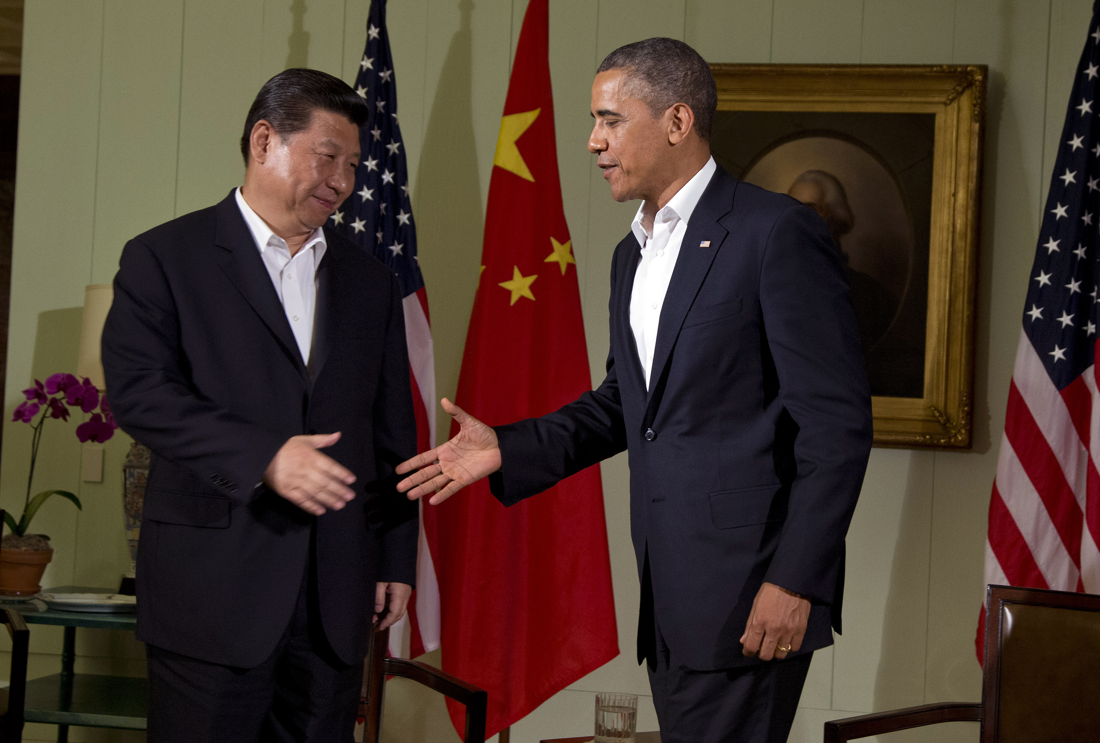 President Barack Obama, right, shakes hands with Chinese President Xi Jinping (AP/Evan Vucci)