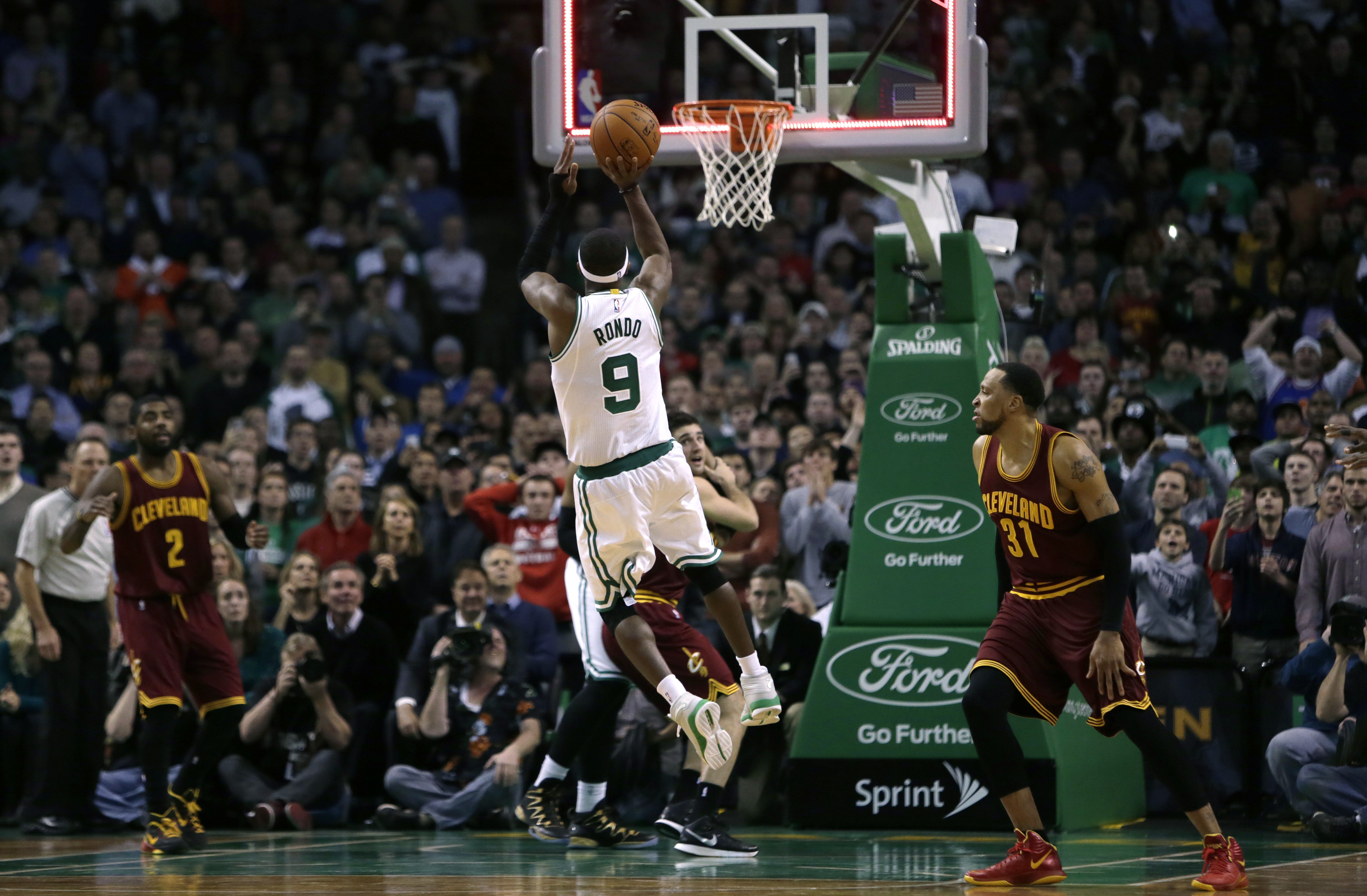 Boston Celtics guard Rajon Rondo (9) puts up a shot at the final buzzer, which he missed, during the second half of an NBA basketball game in Boston, Friday, Nov. 14, 2014. The Cavaliers edged out the Celtics 122-121. (AP Photo/Charles Krupa) (AP)