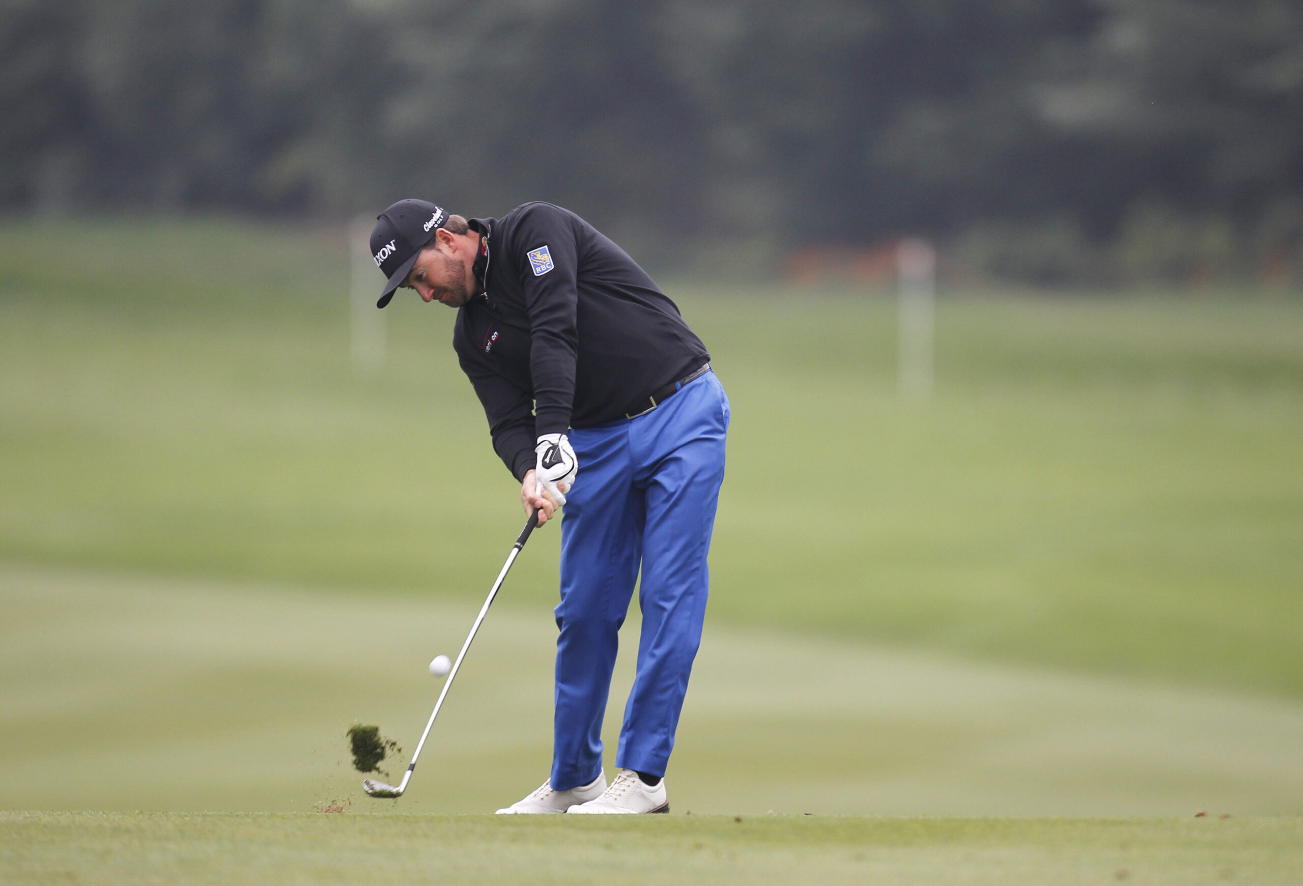Graeme Mcdowell of Northern Ireland hits a shot at 10th hole during the 3rd round of the HSBC Champions golf tournament at the Sheshan International Golf Club in Shanghai, China Saturday Nov.8, 2014. (AP Photo) (AP)