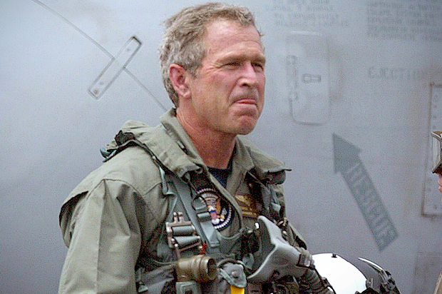 George W. Bush walks the deck of the  aircraft carrier USS Abraham Lincoln, May 1, 2003 (AP/Damian Dovarganes)