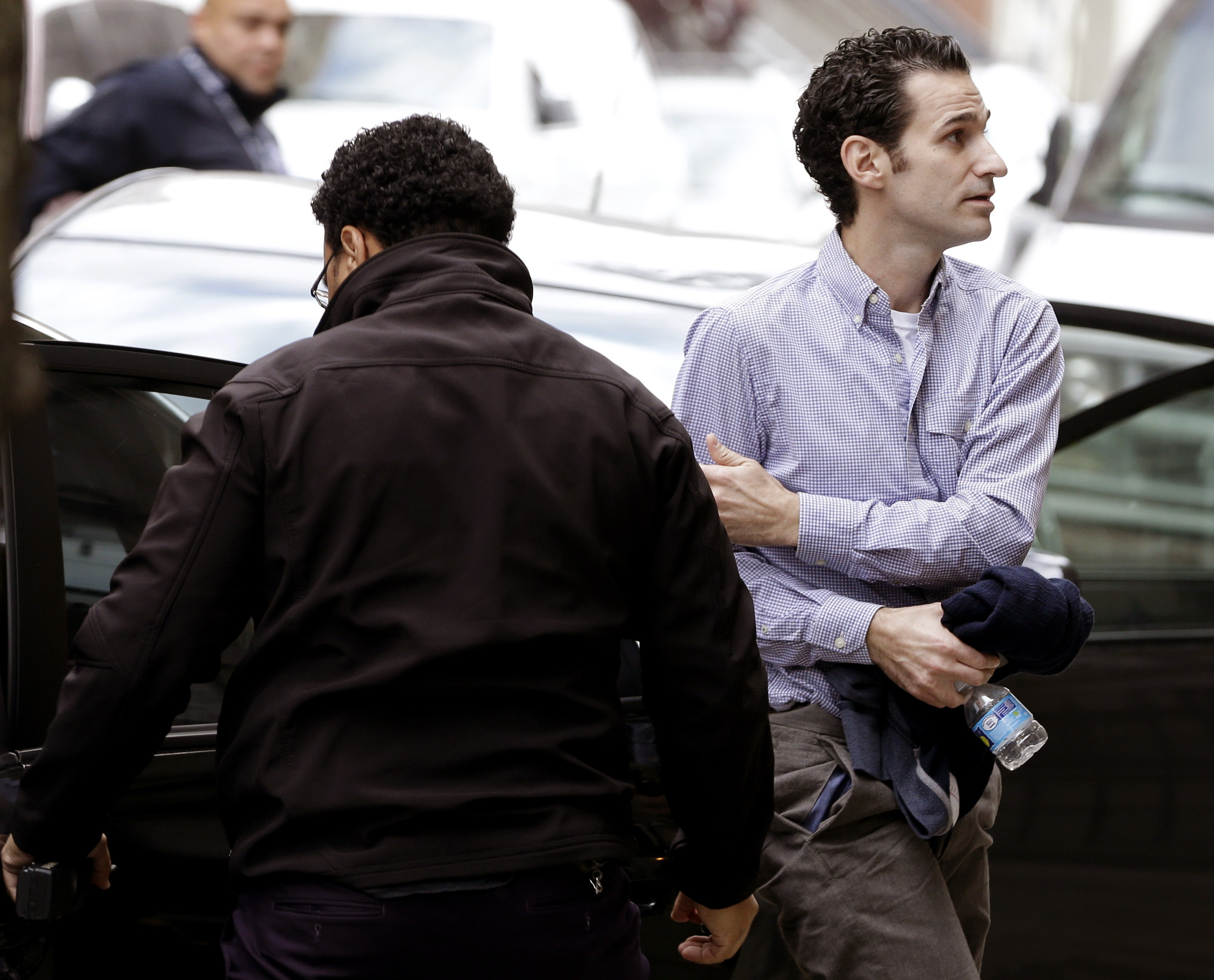Dr. Craig Spencer, who was the first Ebola patient in New York City, arrives to his apartment building after being discharged from Bellevue Hospital in New York, Tuesday, Nov. 11, 2014. (AP/Seth Wenig)