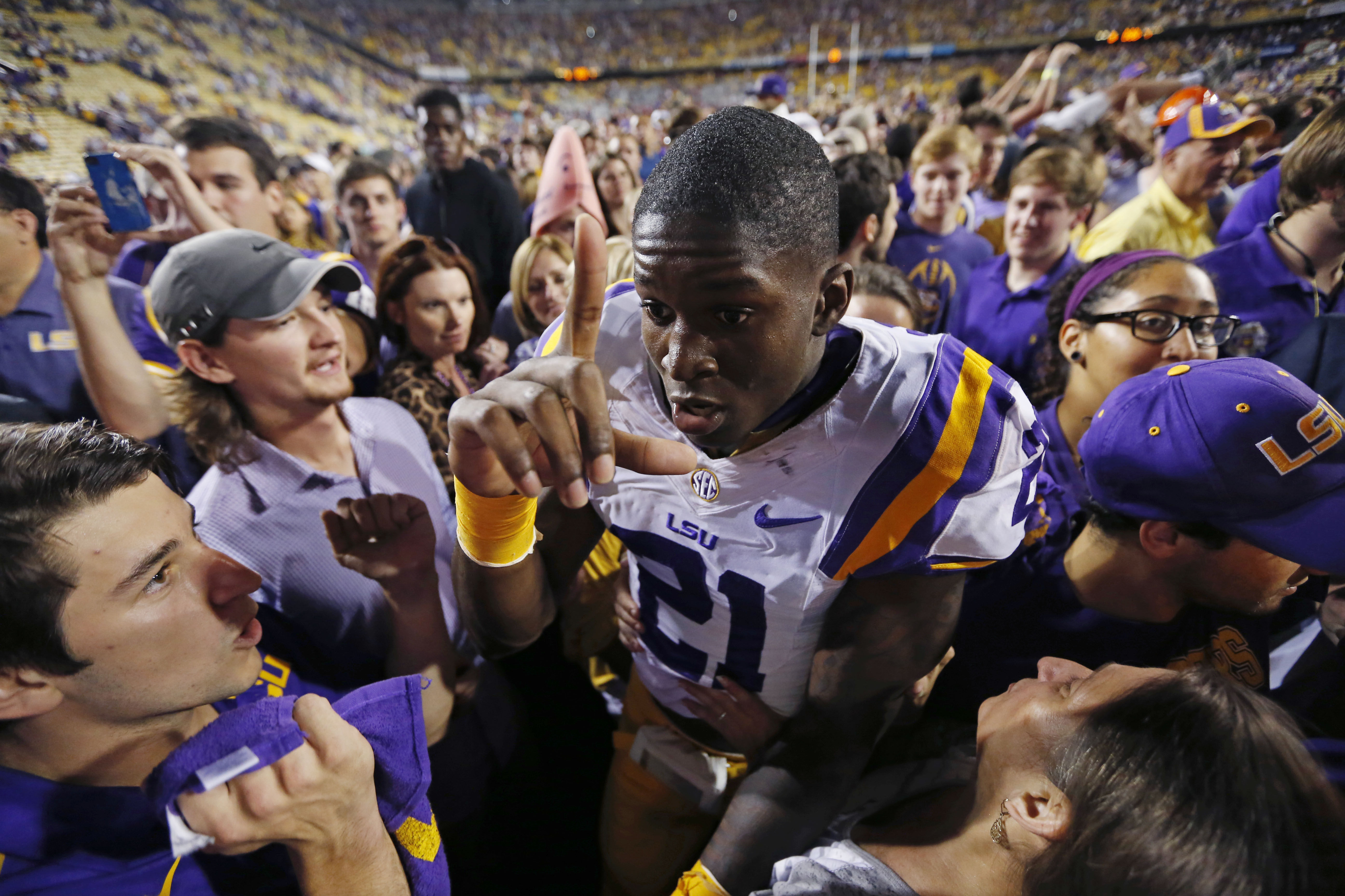 FILE - In this Oct. 25, 2014, file photo, LSU defensive back Rashard Robinson (21) celebrates after the team's NCAA college football game against Mississippi in Baton Rouge, La. Alabama and LSU meet in Baton Rouge, La., on Saturday, Nov. 8. Alabama is ranked second among all Football Bowl Subdivision teams and LSU is fourth in scoring defense. (AP Photo/Jonathan Bachman, File) (AP)