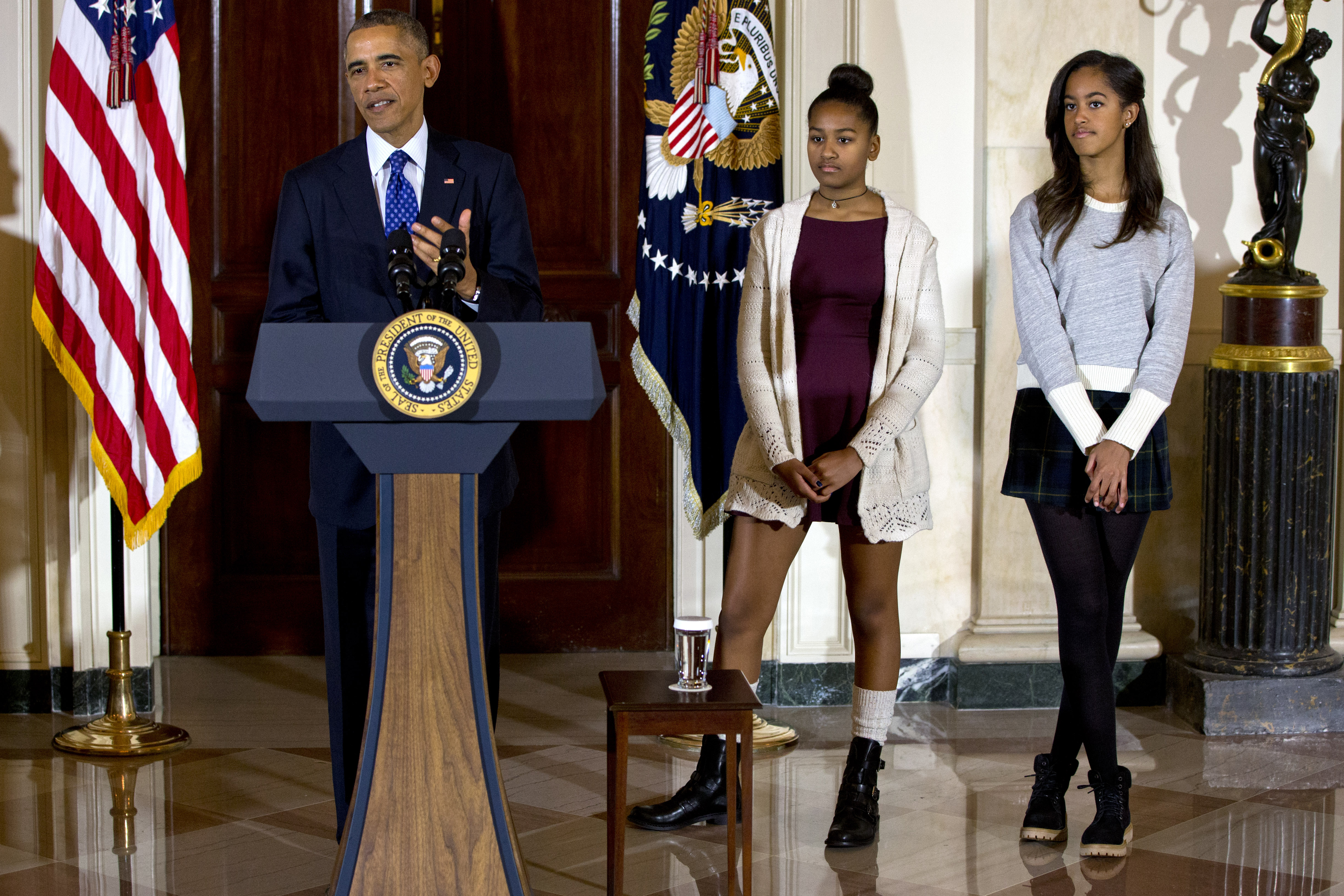 President Barack Obama with his daughters, Sasha and Malia (Associated Press)