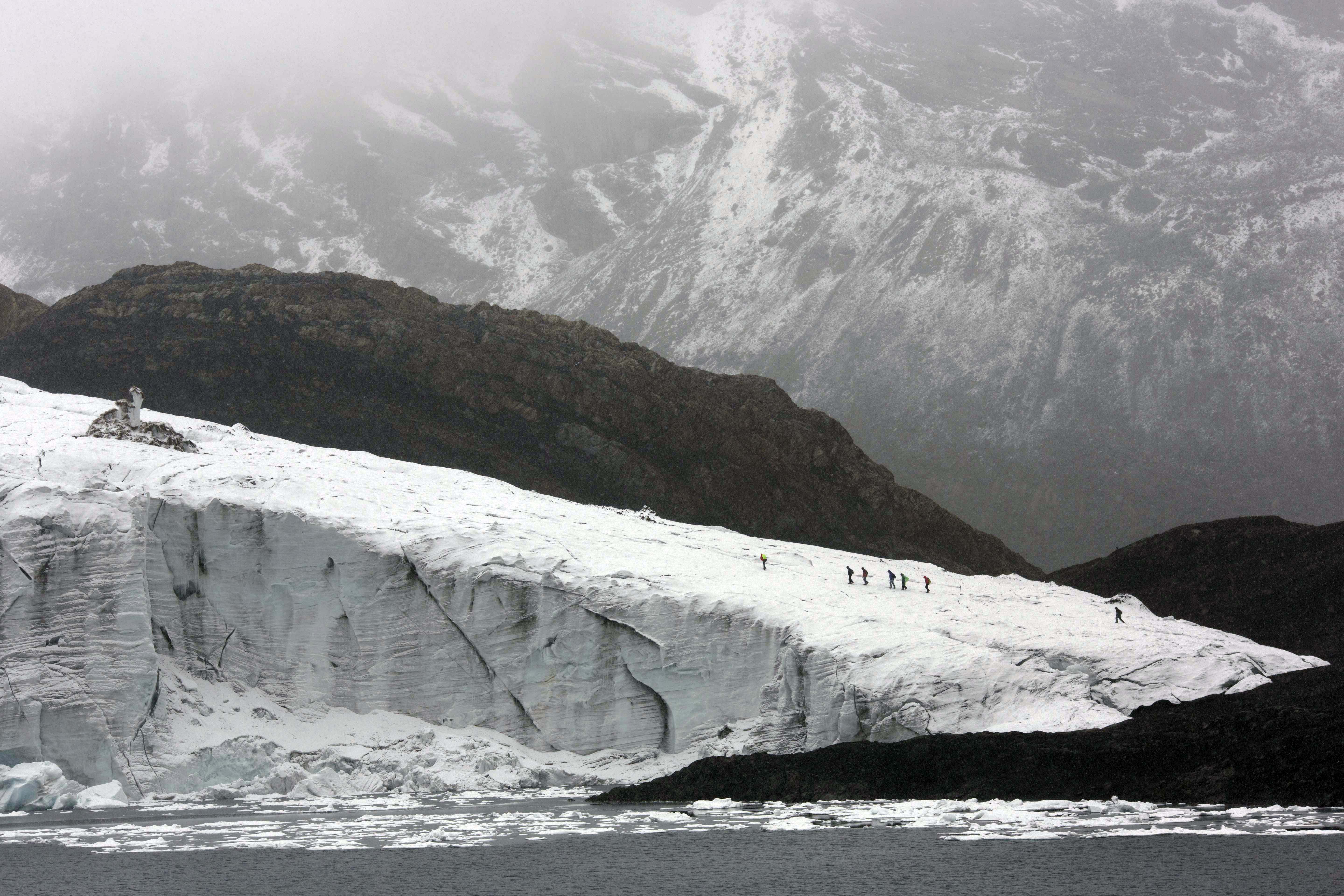 AP10ThingsToSee - Members of the glaciology unit of Peru's national water authority walk on the Pastoruri glacier in Huaraz, Peru, Thursday, Dec. 4, 2014. (AP)