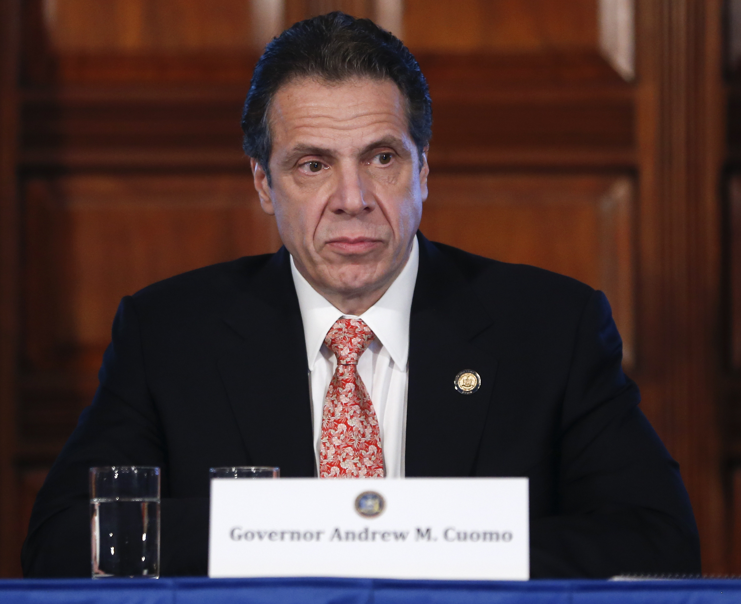 New York Gov. Andrew Cuomo watches a presentation on hydraulic during a cabinet meeting at the Capitol on Wednesday, Dec. 17, 2014, in Albany, N.Y. Cuomos administration will move to prohibit fracking in the state, citing unresolved health issues and dubious economic benefits of the widely used gas-drilling technique. (AP Photo/Mike Groll) (AP)