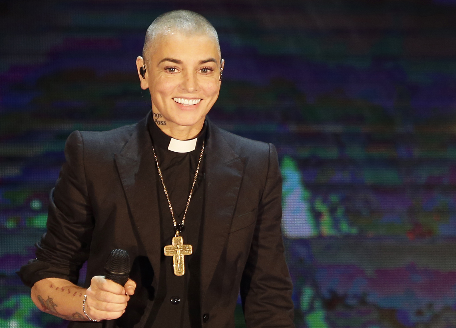 FILE - This is a Sunday, Oct. 5, 2014  file photo of Irish singer Sinead O'Connor performs during the Italian State RAI TV program "Che Tempo che Fa", in Milan, Italy.  OConnor, long a critic of church and state in Ireland, says shes joining the Irish nationalist Sinn Fein party _ and wants its leaders to step aside for younger voices free of IRA connections. The 48-year-old singer, who recently released her 10th album ``Im Not Bossy, Im the Boss, says Sinn Fein is the only left-wing party able to steer Ireland toward social equality. (AP Photo/Antonio Calanni, File) (AP Photo/Antonio Calanni, File)