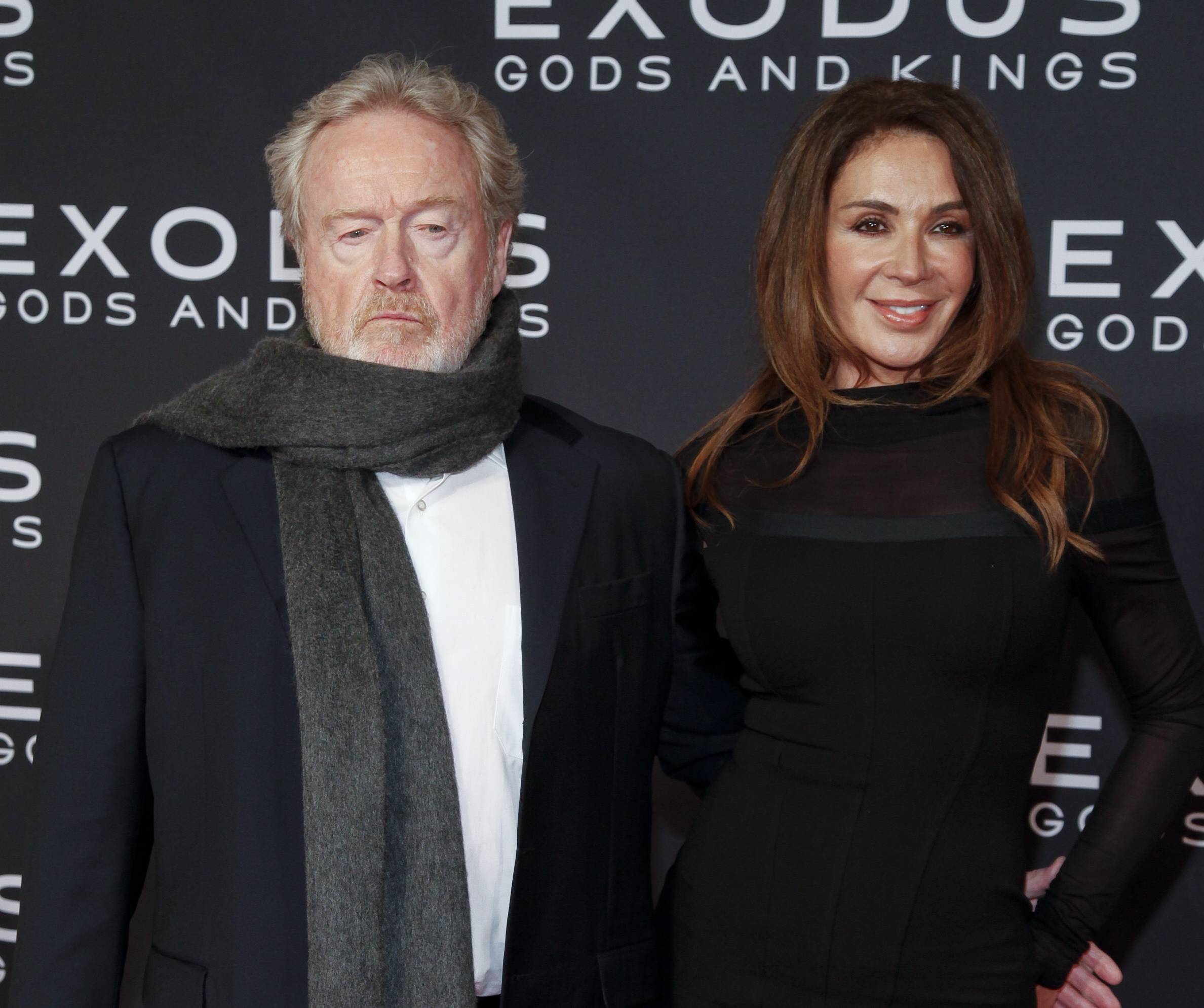 Ridley Scott, left, and Giannina Facio, right, attend the premiere of "Exodus: Gods and Kings" at The Brooklyn Museum on Sunday, Dec. 7, 2014, in New York. (Andy Kropa/Invision/AP)