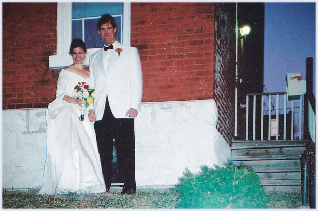 A photo of the author and his wife in front of their St. Louis home