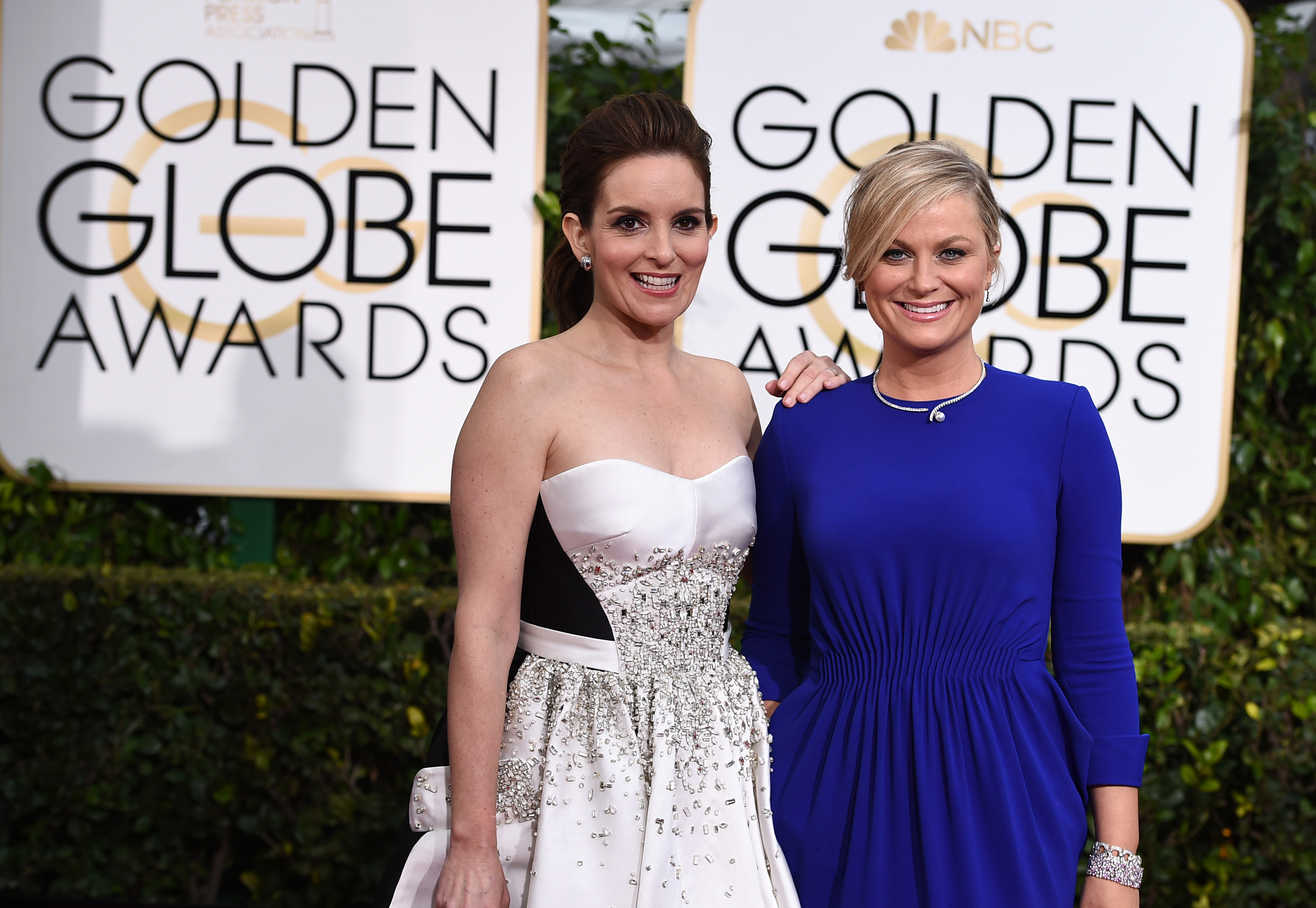 Tina Fey, left, and Amy Poehler arrive at the 72nd annual Golden Globe Awards. (Jordan Strauss/invision/ap)