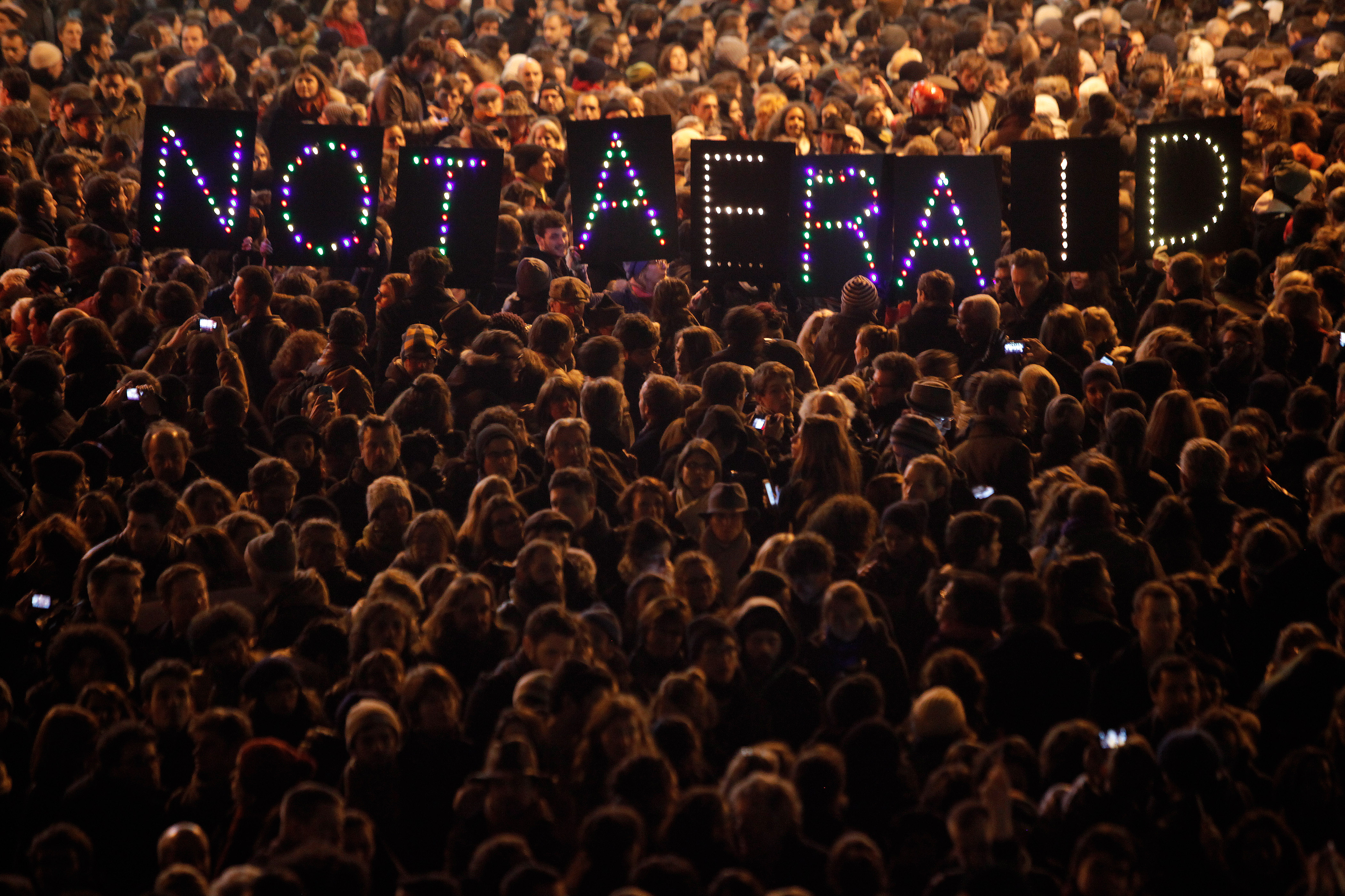 People gather in solidarity of the victims of a terror attack against a satirical newspaper, in Paris (AP Photo/Thibault Camus) (AP)