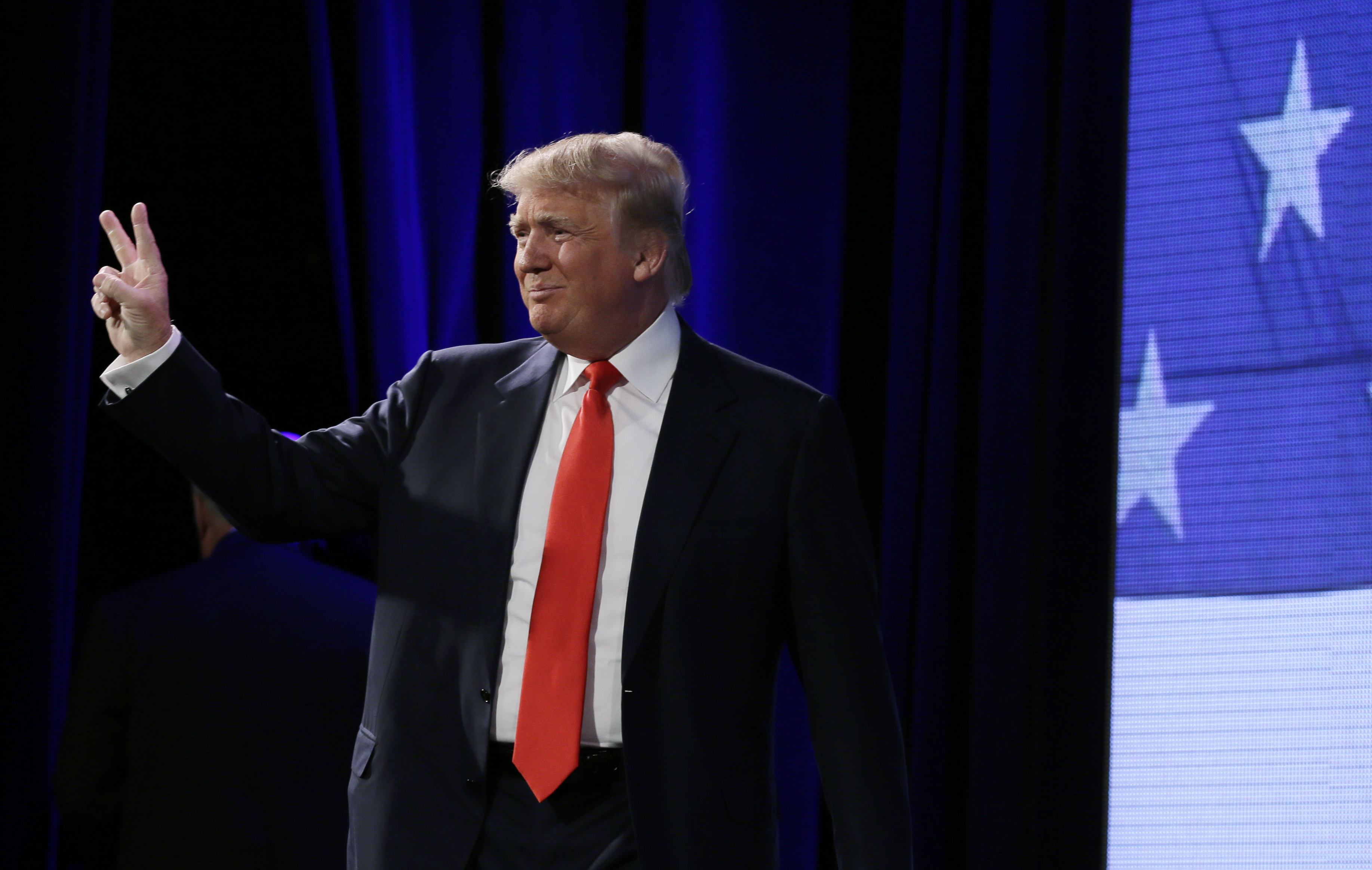 Donald Trump gestures to the audience before speaking at the Freedom Summit, Saturday, Jan. 24, 2015, in Des Moines, Iowa. (AP Photo/Charlie Neibergall) (AP)