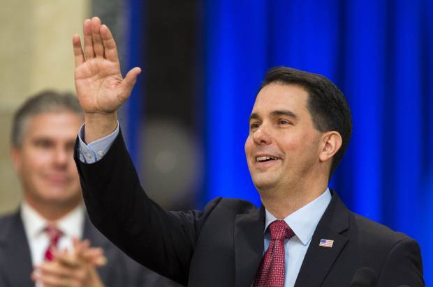 Wisconsin Gov. Scott Walker acknowledges the crowd after being inaugurated for his second term. (AP/Andy Manis)