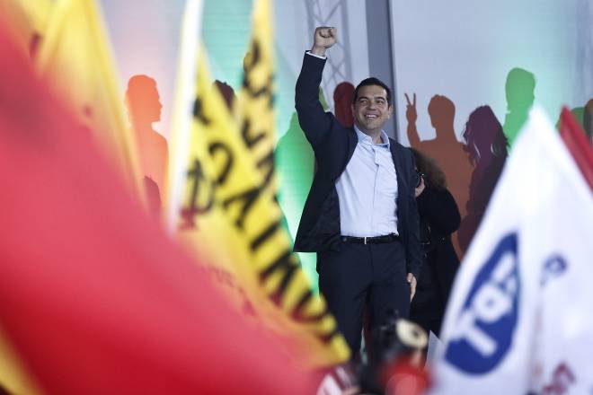 Alexis Tsipras, leader of Greece's Syriza left-wing main opposition party waves to his supporters as he arrives for a pre-election speech at Omonia Square in Athens (AP Photo/Petros Giannakouris)