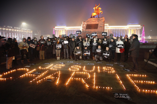 Mongolian journalists at a candlelight vigil at Genghis Square, in Ulan Bator January 9, 2015. (Reuters/Rentsendorj Bazarsukh)
