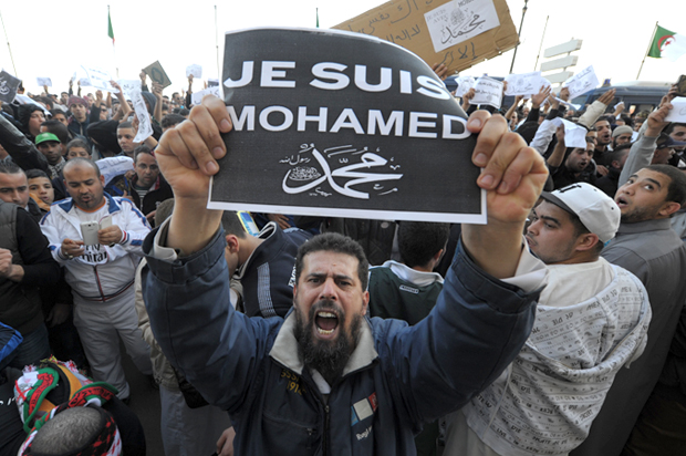 A demonstrator in Algiers, Algeria, Friday, Jan. 16, 2015. (AP/Sidali Djarboub)
