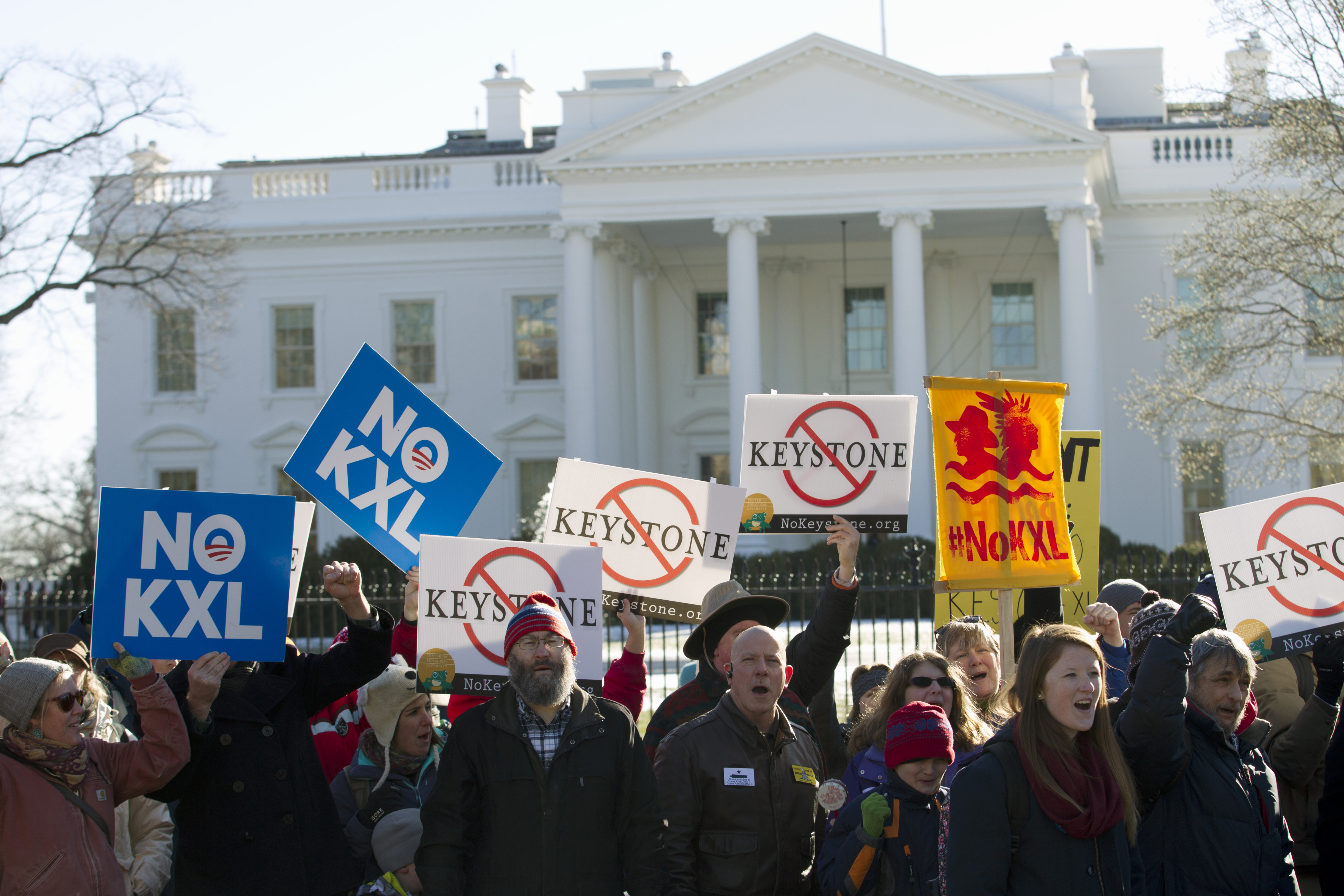 FILE - In this Jan. 10, 2015 file photo, demonstrators stand in front of the White House in Washington, during a rally in support of President Barack Obama's pledge to veto any legislation approving the Keystone XL pipeline. Supporters of the Keystone XL pipeline say the privately-funded, $8 billion project is a critically needed piece of infrastructure that will create thousands of jobs and make the U.S. dependent on oil from friends, rather than foes. Critics claim it will be disastrous for the pollution blamed for global warming and put communities along its 1,179-mile route at risk for an environmentally-damaging spill, all for oil and products that will be exported anyway. (AP Photo/Jose Luis Magana, File) (AP)