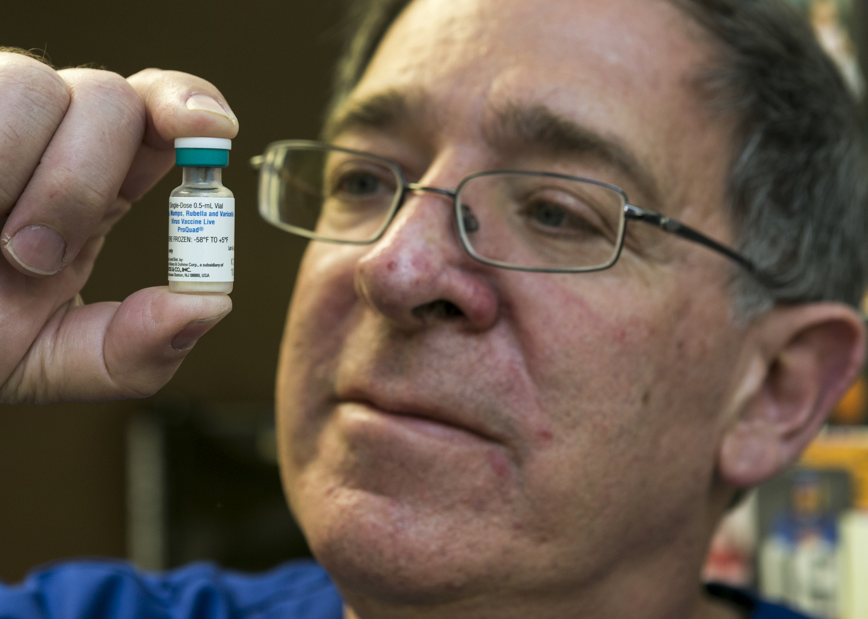 Pediatrician Charles Goodman holds a dose of the measles-mumps-rubella vaccine, or MMR vaccine at his practice in Northridge, Calif., Thursday, Jan. 29, 2015.   Some doctors are adamant about not accepting patients who don't believe in vaccinations, with some saying they don't want to be responsible for someone's death from an illness that was preventable. Others warn that refusing treatment to such people will just send them into the arms of quacks. (AP Photo/Damian Dovarganes) (AP)
