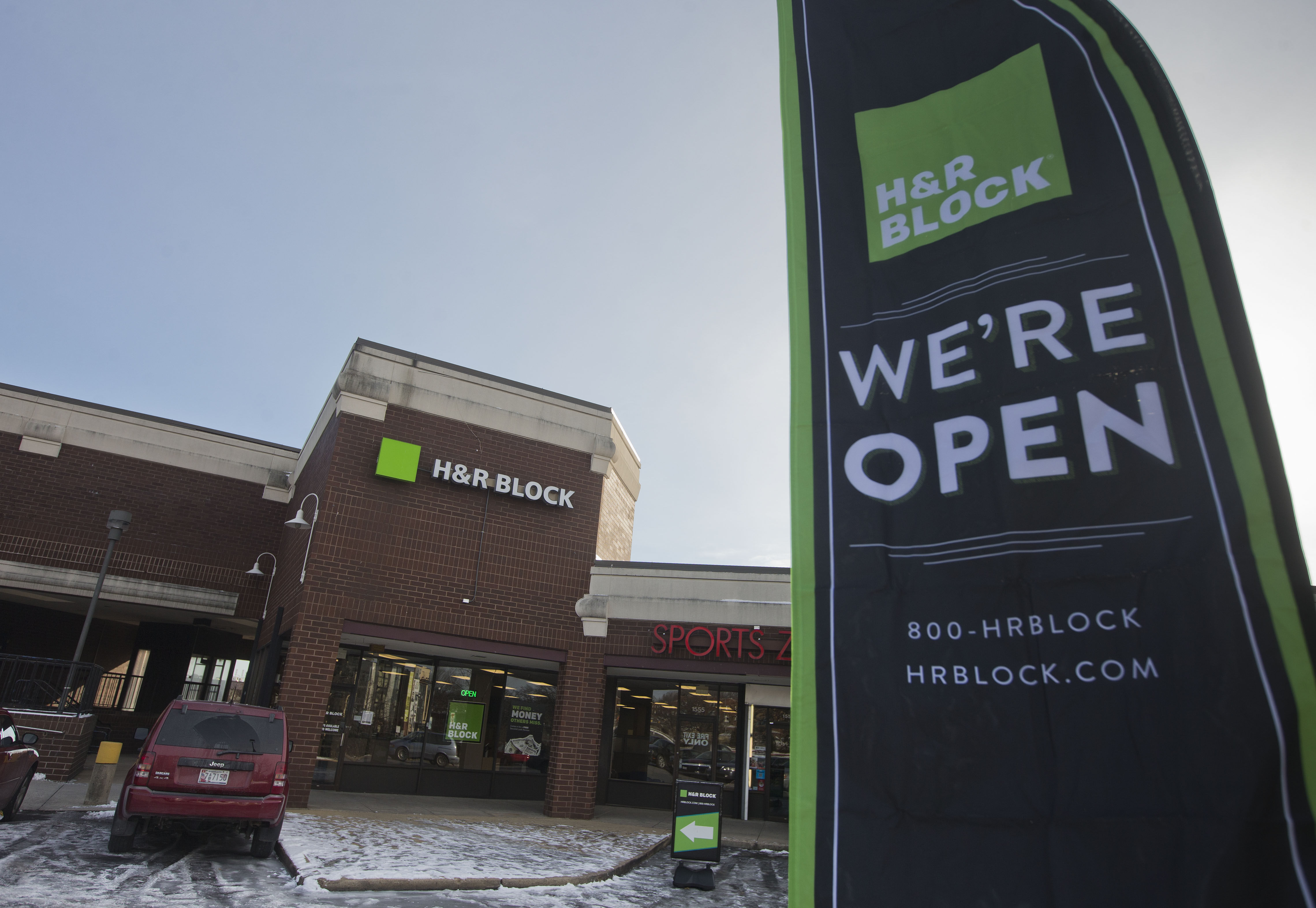 In this Thursday, Jan. 8, 2015 photo, an ad banner appears on display in the parking lot of the H&R Block offices in the Atlas District in Washington. The Internal Revenue Service said it would begin accepting electronic returns and processing paper ones as scheduled on Jan. 20, 2015.  (AP Photo/Pablo Martinez Monsivais) (AP Photo/Pablo Martinez Monsivais)