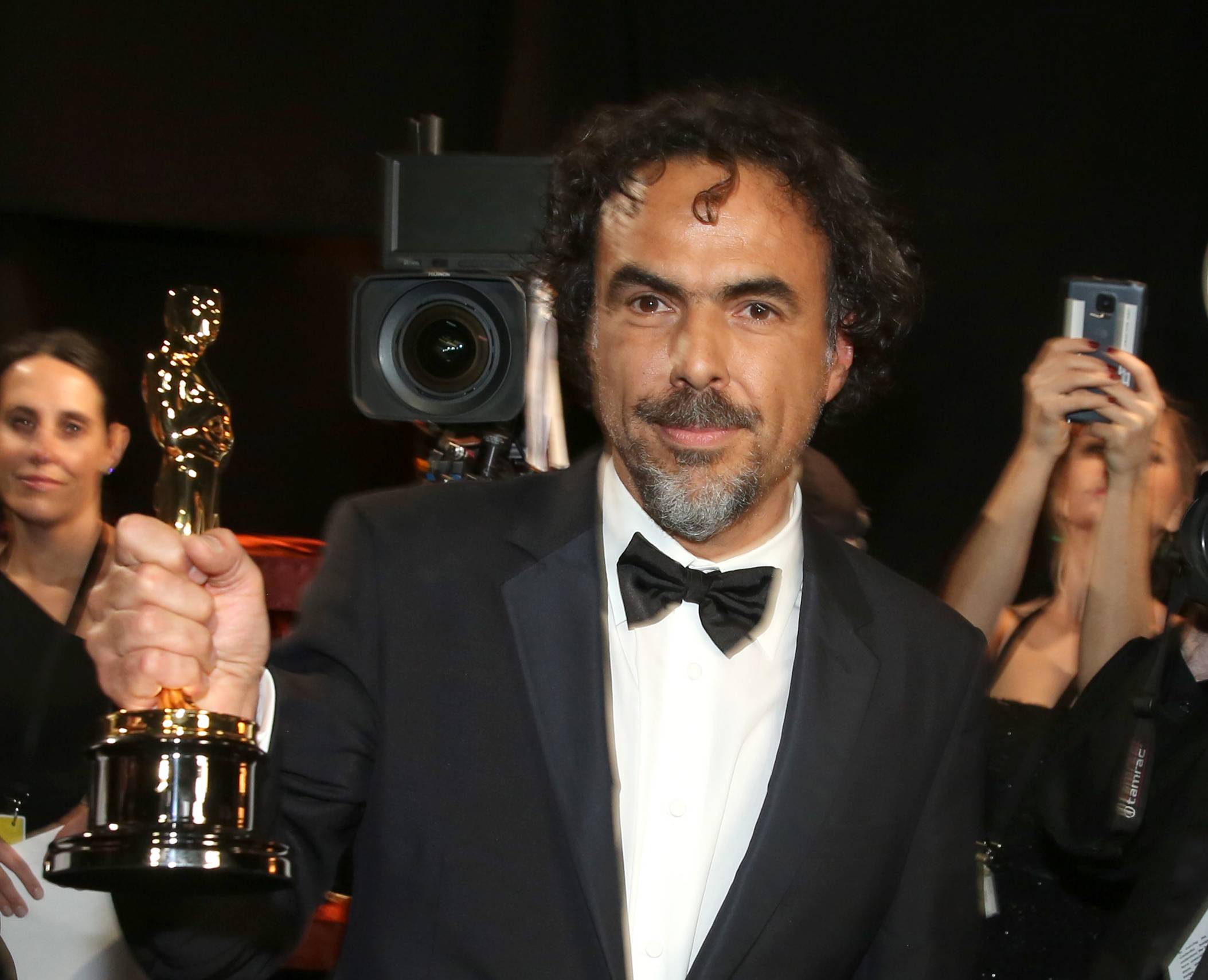 Alejandro Gonzalez Inarritu appears backstage with his award for best director for "Birdman" at the Oscars on Sunday, Feb. 22, 2015, at the Dolby Theatre in Los Angeles. (Photo by Matt Sayles/Invision/AP) (Matt Sayles/invision/ap)