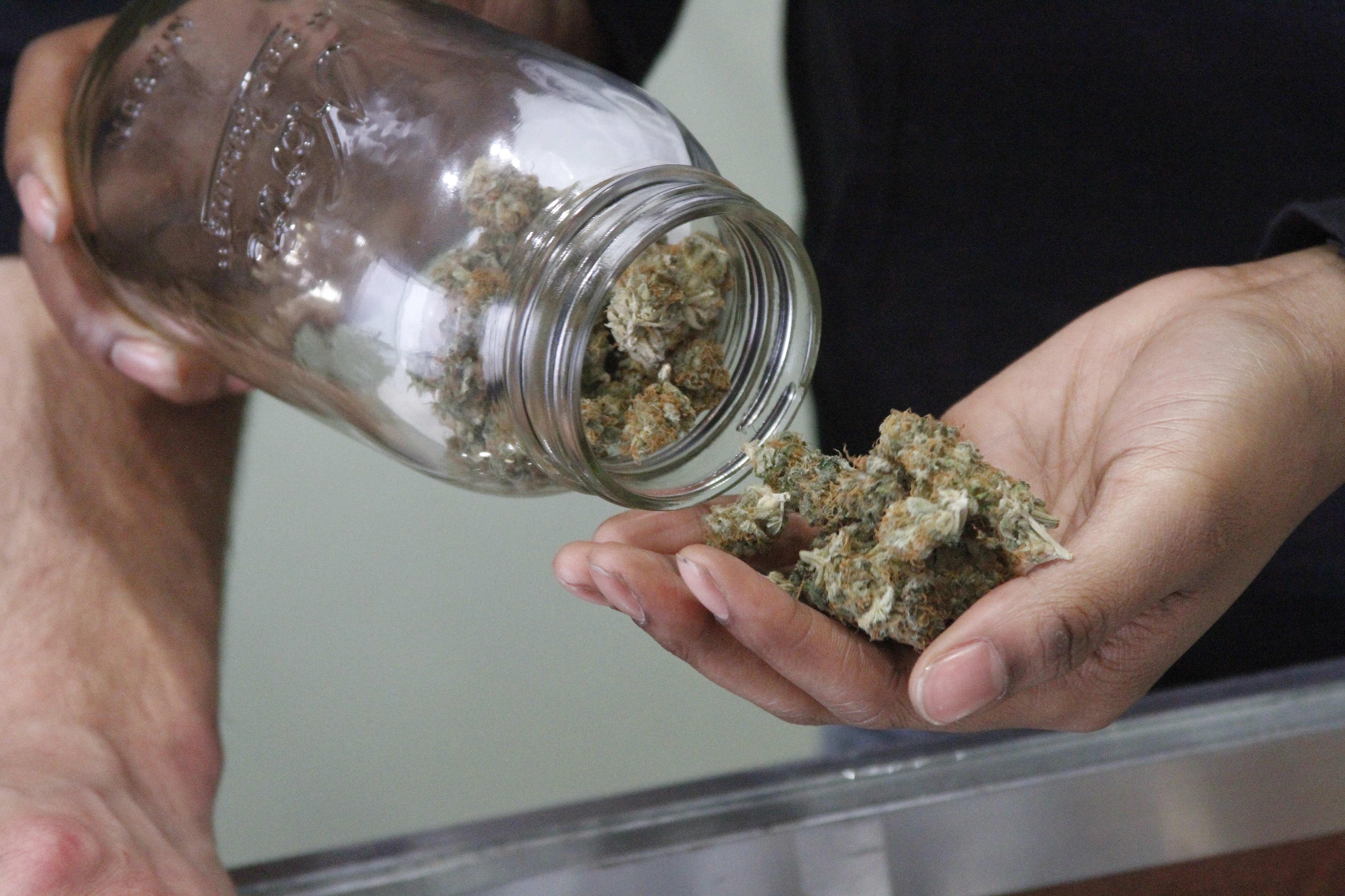 In this Feb. 20, 2015 photo, Alaska Cannabis Club CEO Charlo Greene prepares to roll a joint at the medical marijuana dispensary in Anchorage, Alaska. On Tuesday, Feb. 24, 2015, Alaska will become the third state in the nation to legalize marijuana. (AP/Mark Thiessen)