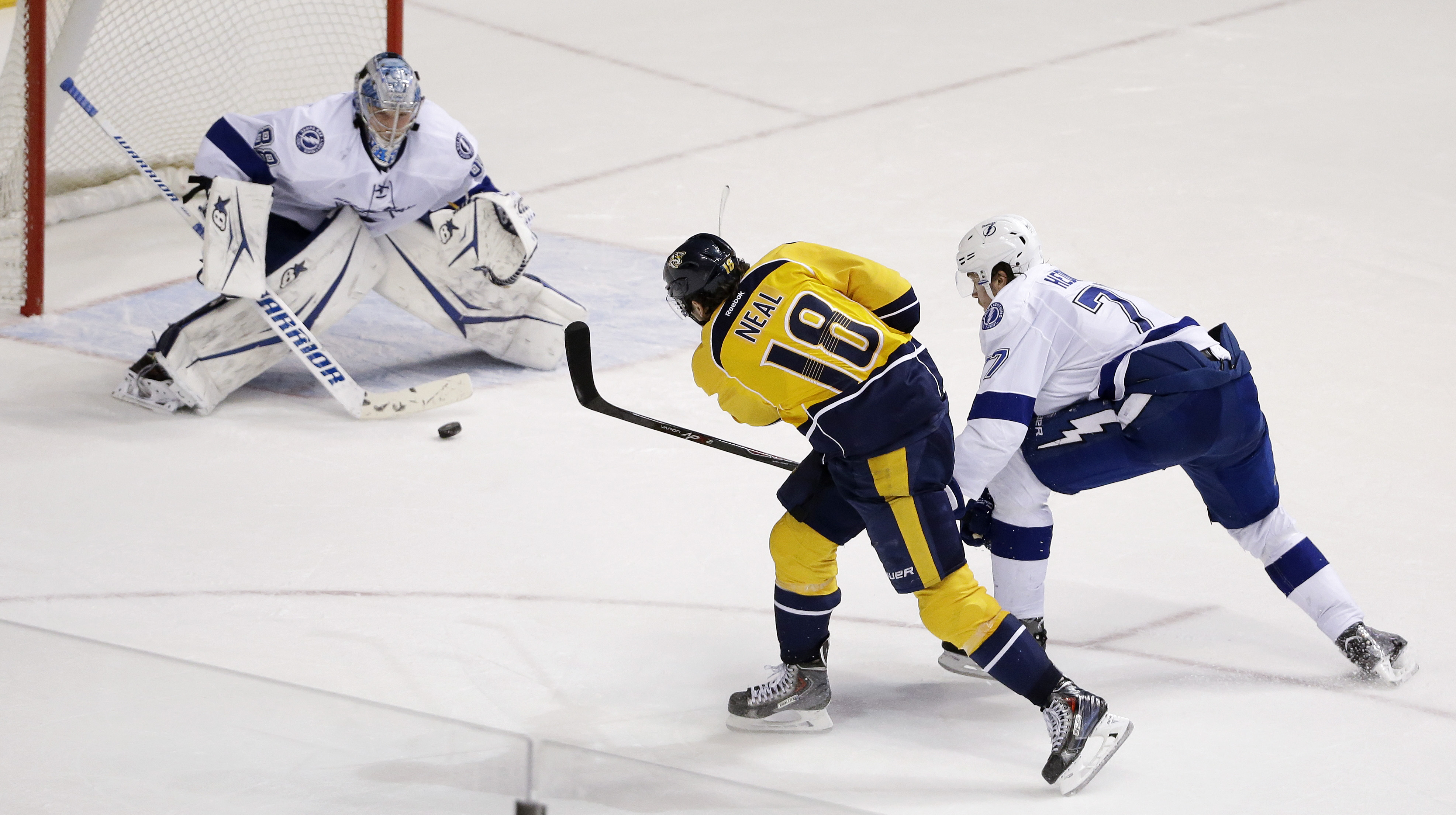 Nashville Predators left wing James Neal (18) scores the game-winning goal against Tampa Bay Lightning goalie Andrei Vasilevskiy (88), of Russia, in the overtime period of an NHL hockey game Tuesday, Feb. 10, 2015, in Nashville, Tenn. At right is Lightning defenseman Victor Hedman, of Sweden. The Predators won 3-2. (AP Photo/Mark Humphrey) (AP)