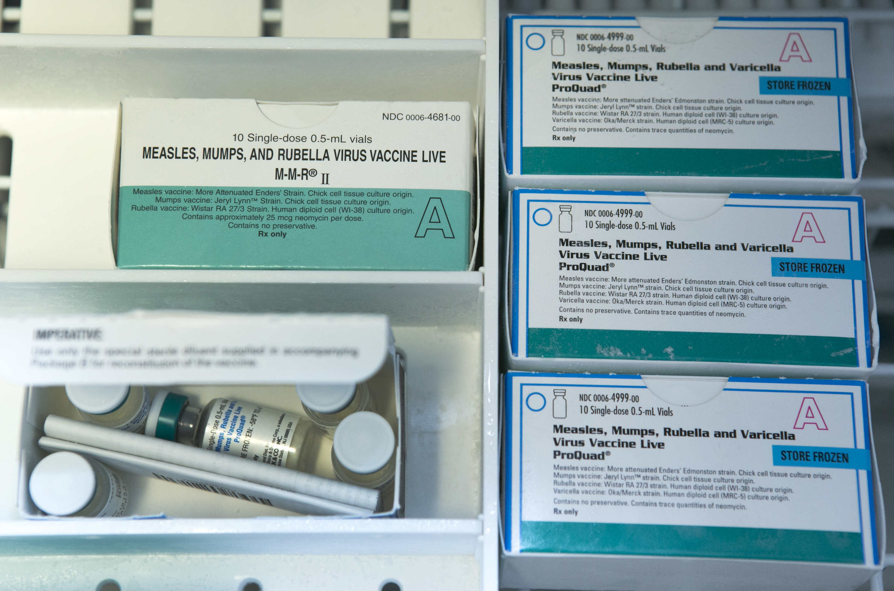 This Thursday, Jan. 29, 2015 file photo shows boxes of the measles, mumps and rubella virus vaccine (MMR) and measles, mumps, rubella and varicella vaccine inside a freezer at a doctor's office in Northridge, Calif. Vaccinations can cause minor side effects including redness at the injection site and sometimes mild fever, but medical experts say serious complications are rare and much less dangerous than the diseases that vaccines prevent. (AP Photo/Damian Dovarganes) (AP)