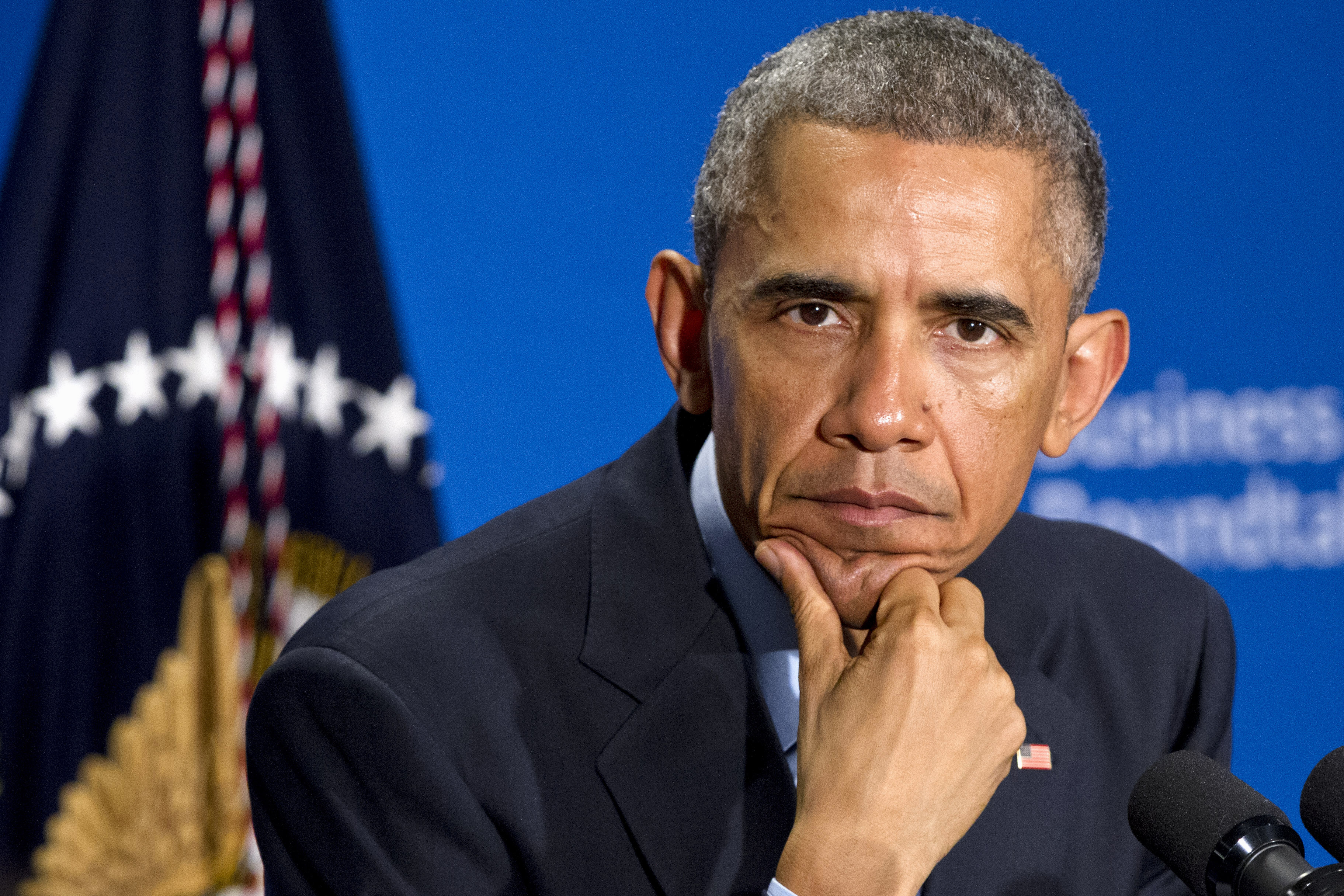 FILE - In this Dec. 3, 2014 file photo, President Barack Obama listens to a question during a meeting with leading CEOs to discuss ways to promote the economy and create jobs, at the Business Roundtable Headquarters in Washington. (AP/Jacquelyn Martin)