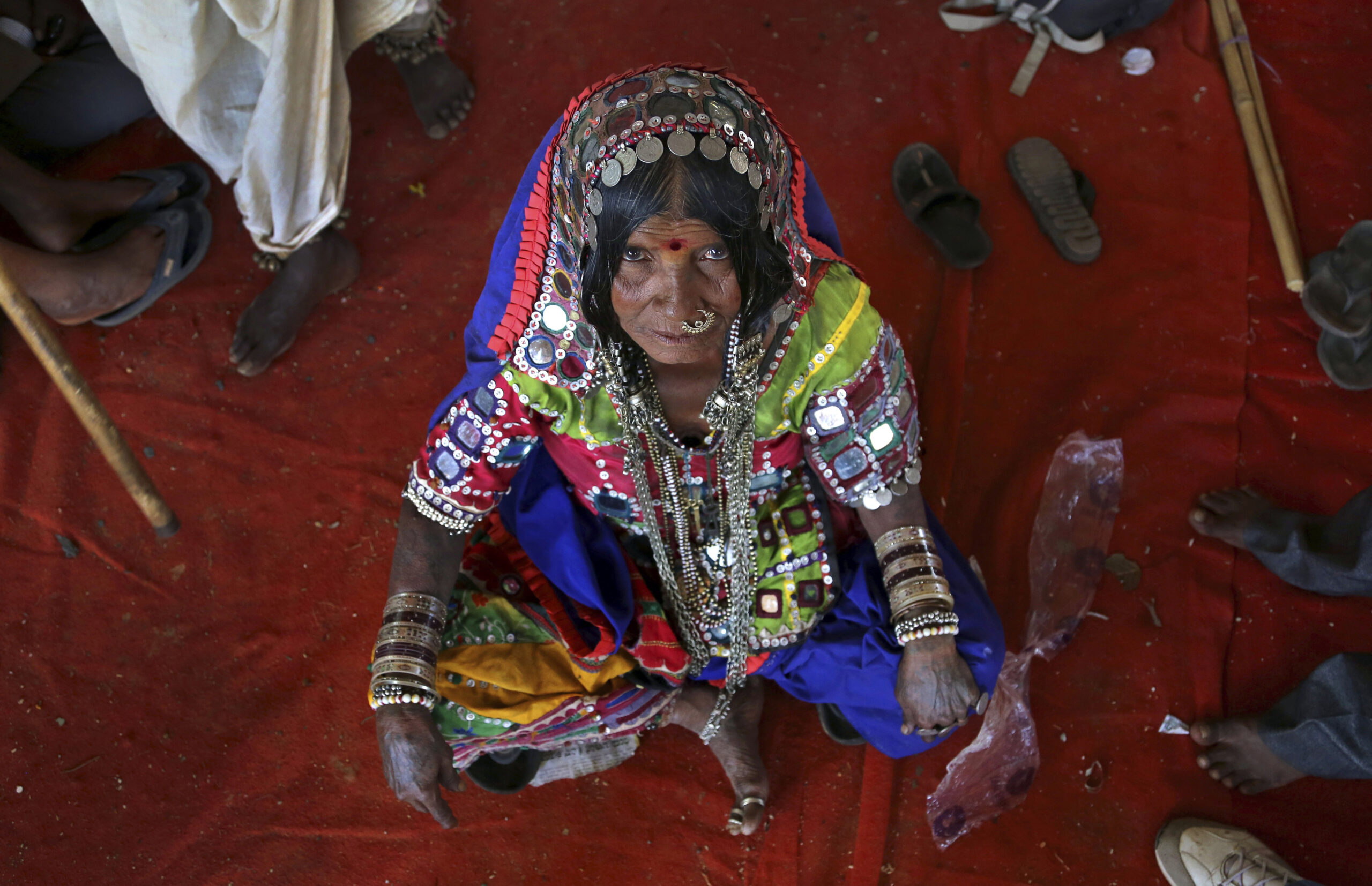Ramavva Lamani, an indigenous Indian woman, looks at the camera as she joins a protest by backward Hindu communities demanding equal rights in Bangalore, India, Wednesday, Feb. 11, 2015. Ancient and deep-rooted patterns of caste discrimination in India have denied tribals and other backward communities economic, education and social rights. (AP Photo/Aijaz Rahi) (Aijaz Rahi)