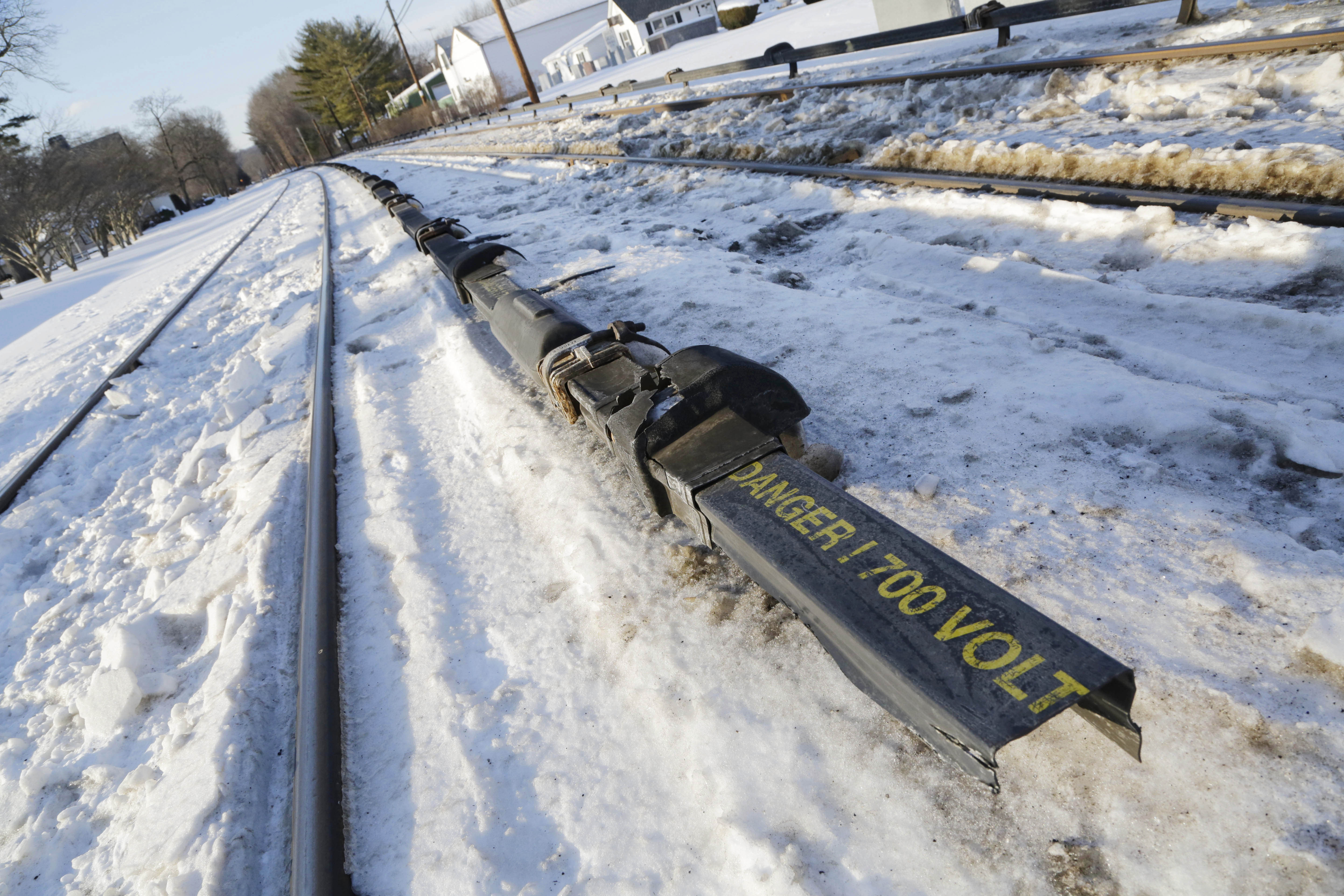 The electrified third rail, center, runs next to Metro-North Railroad tracks, Friday, Feb. 6, 2015, in Valhalla, N.Y. An SUV driver and five train passengers were killed Tuesday evening in a rush-hour collision in Valhalla. (AP Photo/Mark Lennihan) (AP)