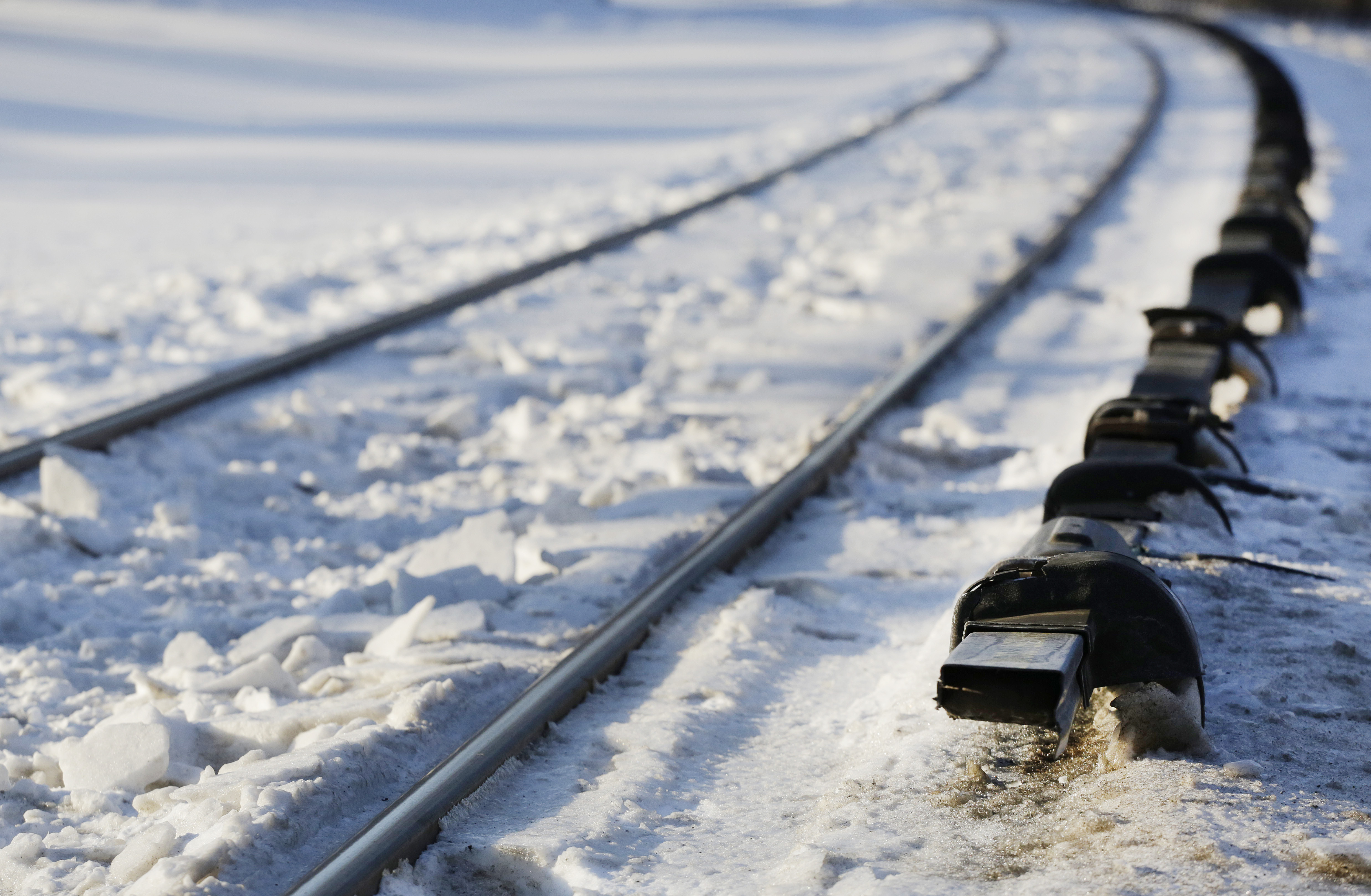 The electrified third rail, right, runs next to Metro-North Railroad tracks, Friday, Feb. 6, 2015, in Valhalla, N.Y. An SUV driver and five train passengers were killed Tuesday evening in a rush-hour collision in Valhalla. (AP Photo/Mark Lennihan) (AP)