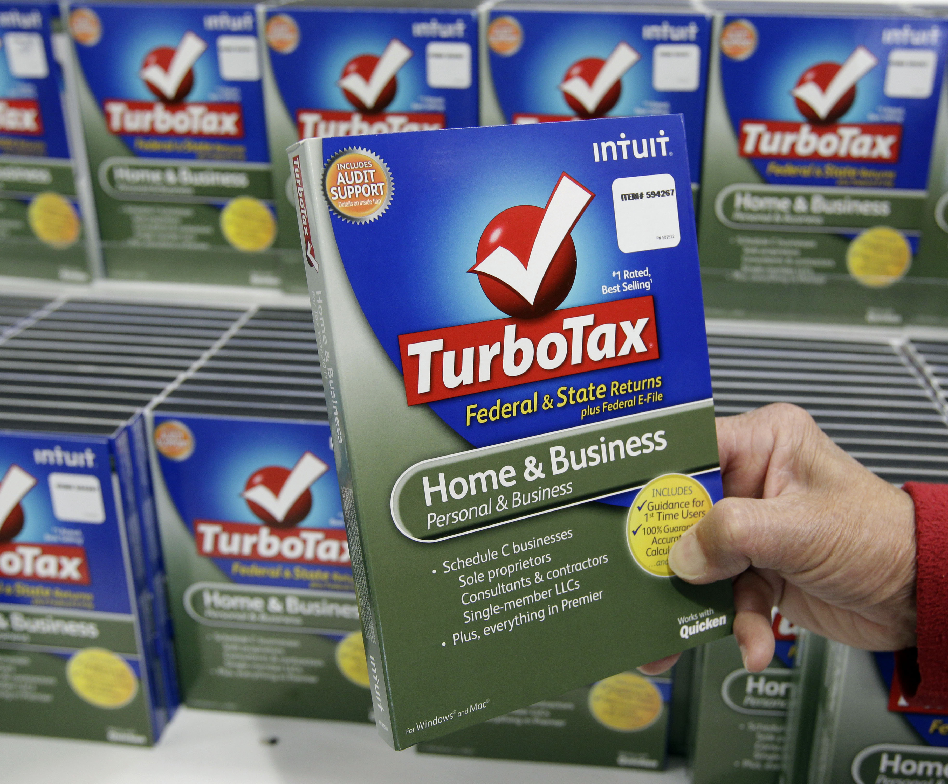 FILE - In this Jan. 24, 2013 file photo, a customer looks at a copy of TurboTax on sale at Costco in Mountain View, Calif. (AP Photo/Paul Sakuma) (AP)