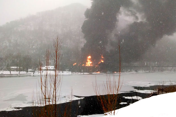 Fire burns at the scene of a train derailment, near Mount Carbon, W.Va, Feb. 16, 2015. (AP/Bob Aaron)
