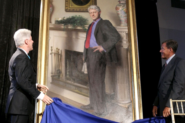Bill Clinton looks up at his portrait after Lawrence M. Small, secretary of the Smithsonian Institution, helped him remove the drape, April 24, 2006. (AP/Haraz N. Ghanbari)